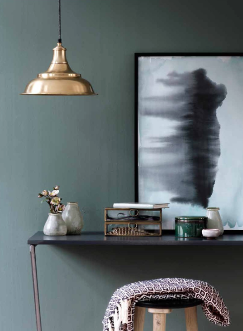 This industrial style lamp from Broste Copenhagen stands out against a neutral background.