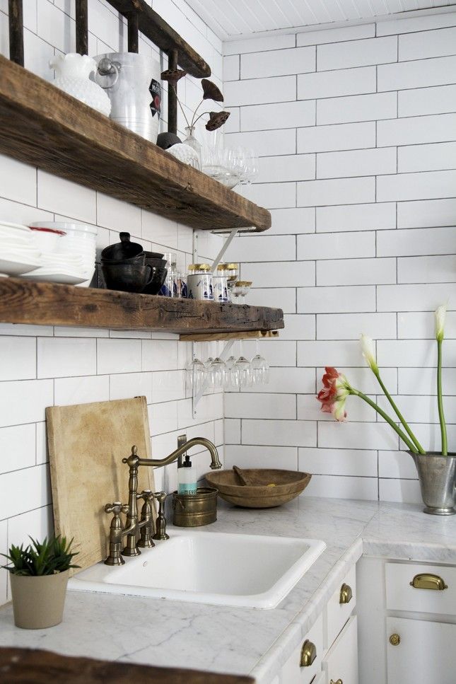 In a rustic style kitchen, brass faucets and handles add a contemporary touch. I love the combination of brass, wood and marble - classic but not showy.