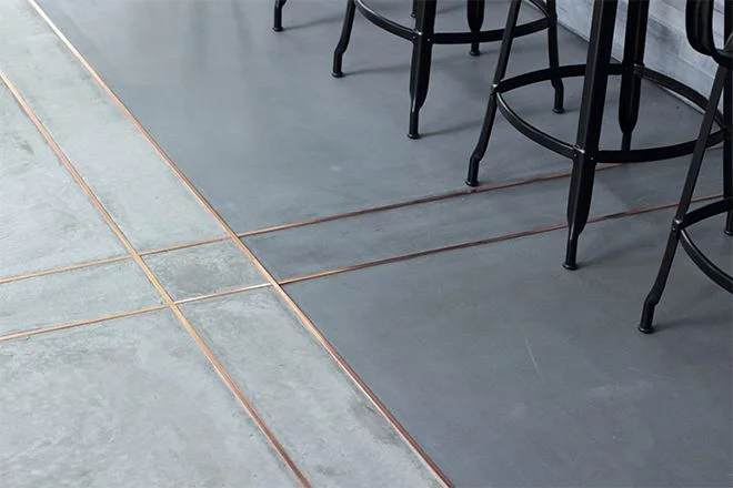 Grout doesn't have to be white! Make floors shine by adding some bling in between tiles.