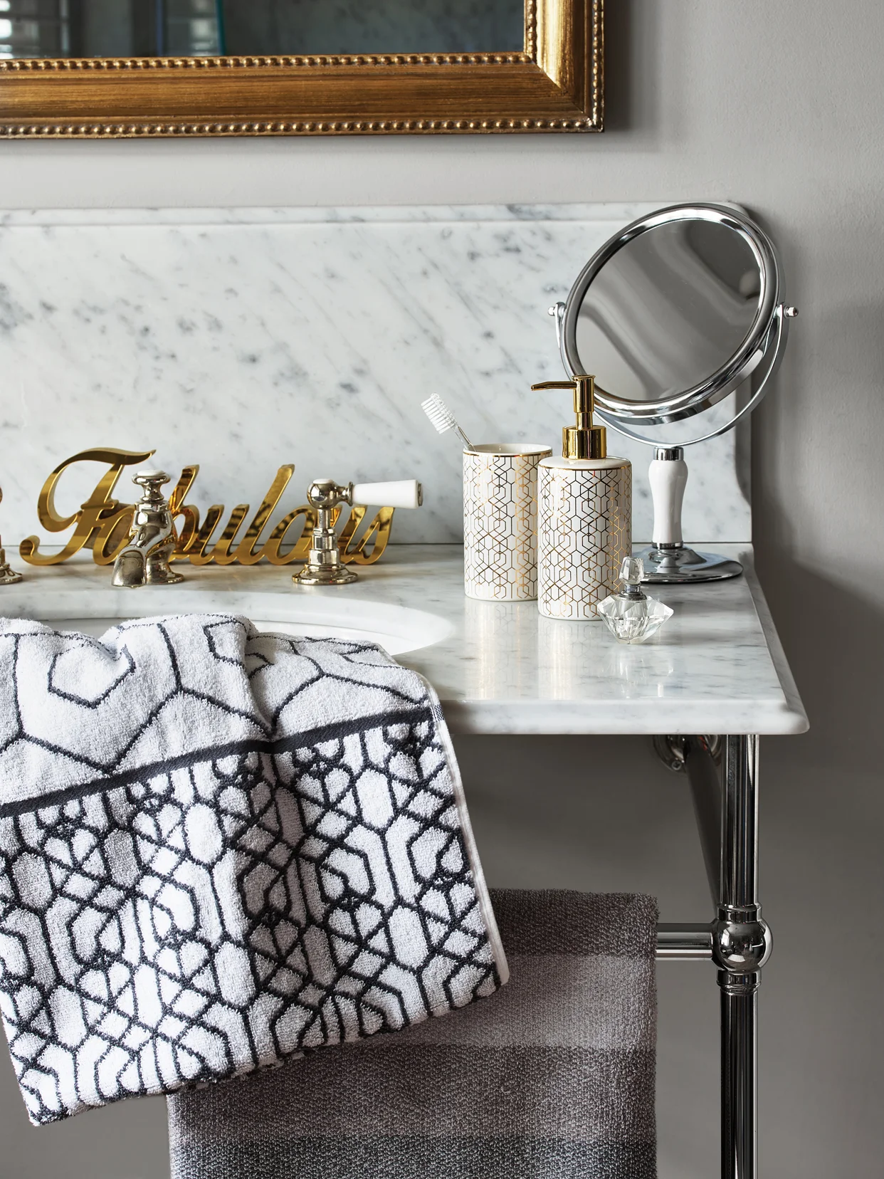 'Fabulous' bath sign - £6, Gold Geo tumbler - £3, Gold Geo dispenser - £5, White and Chrome stand mirror - £8, Grey Geo bath towel - £6, Savoy Stripe bath towel - £6.