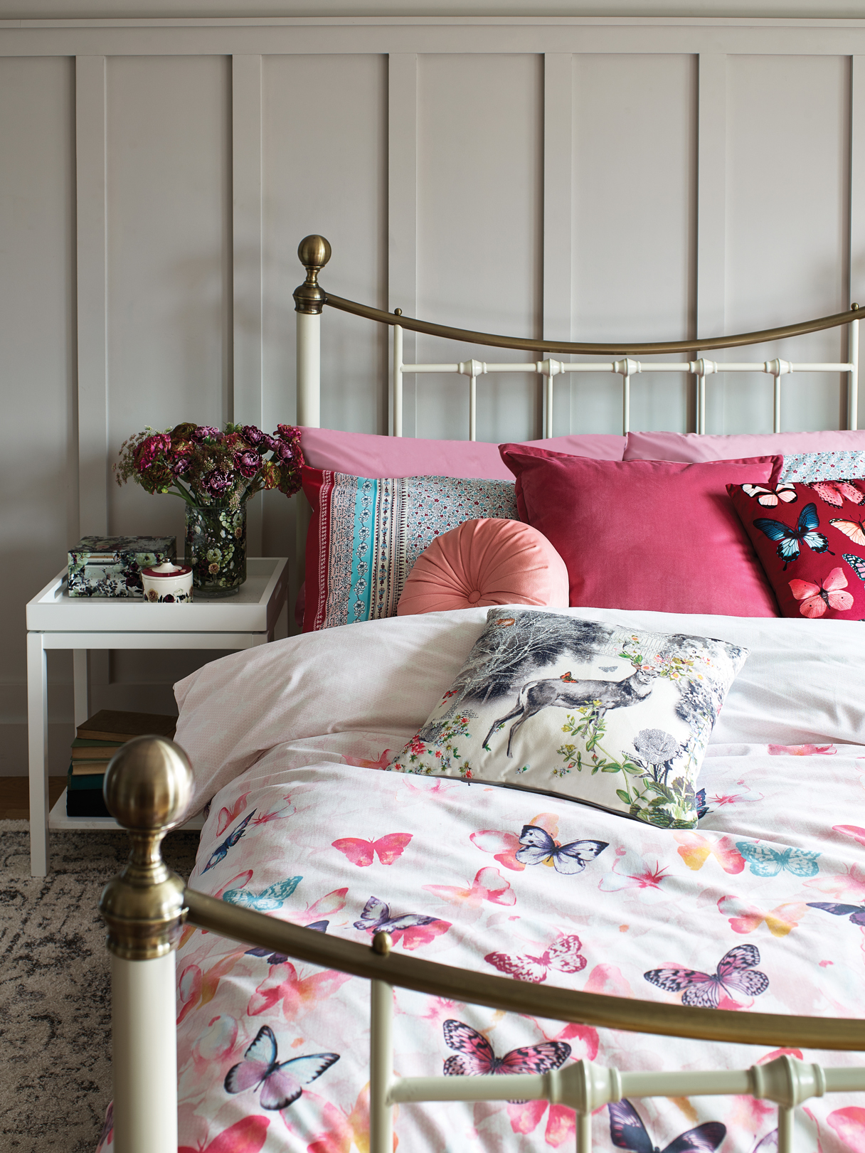 White tray side table - £29, Floral print glass jewellery box - £12, Floral trinket pot - £6, Nancy double bed in cream - £199, Lace butterfly double duvet set - £12, Patchwork double duvet set - £12, Pink round pinwheel cushion - £5, Velvet cushion - £8, Butterfly printed cushion - £5, Deer cushion - £5, Homemaker ivory and grey traditional rug - £40.
