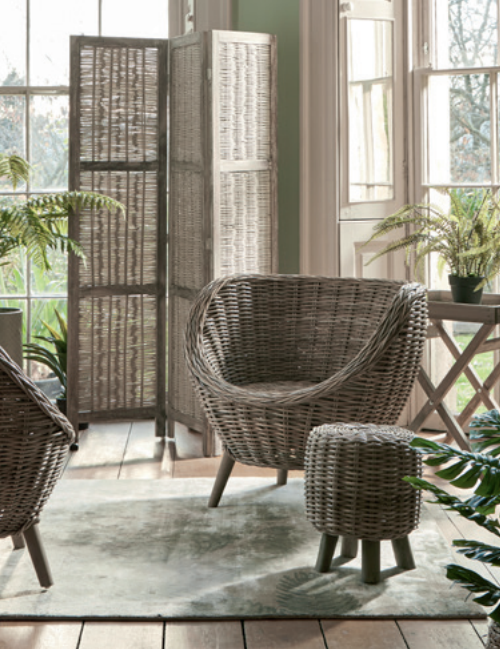 Rattan and wood screen, £150. Rattan tub chair, £275. Round rattan low stool, £75.