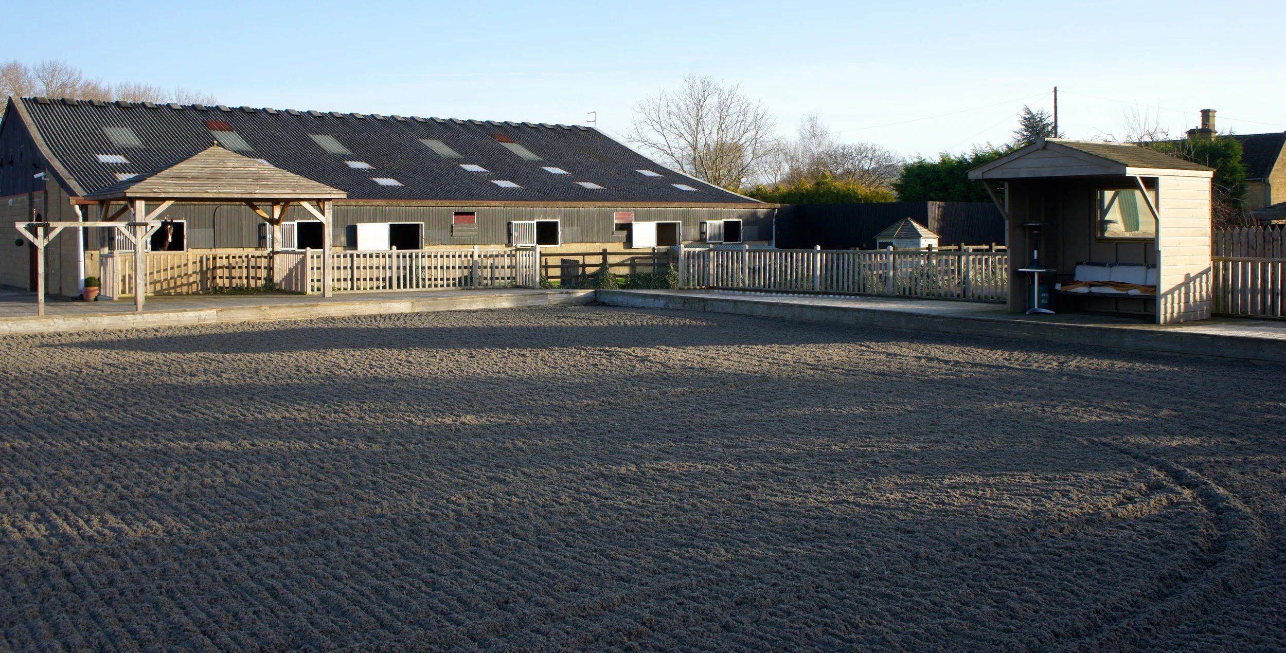 Outdoor Arena with a view onto the stables