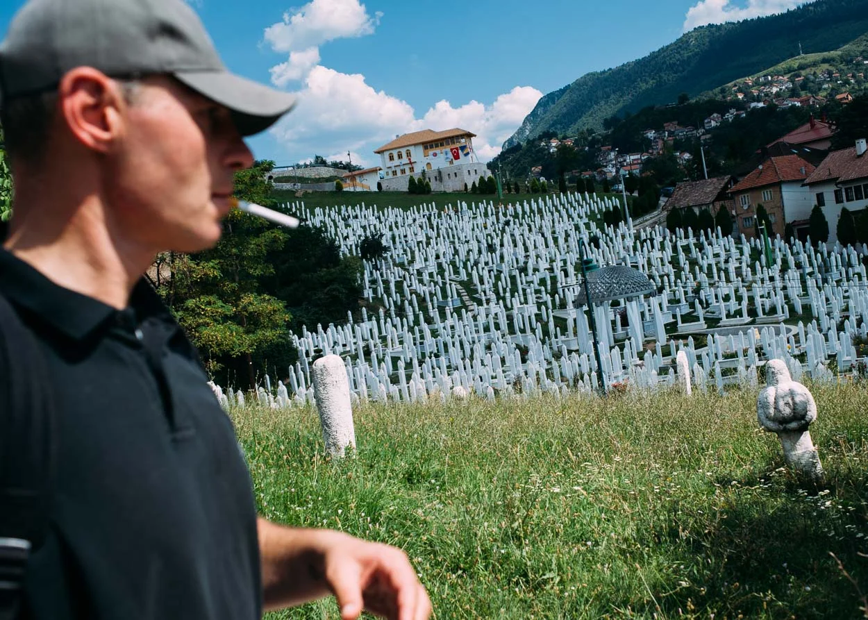 Andrej walks past the Šehidsko Kovaci cemetery, resting place of Alija Izetbegovic, the first president of Bosnia & Herzegovina.