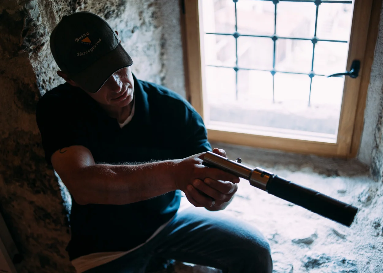 A homemade, single-shot suppressed pistol. Weapons like this were used during the first years of the siege, in lieu of real guns which only came later.