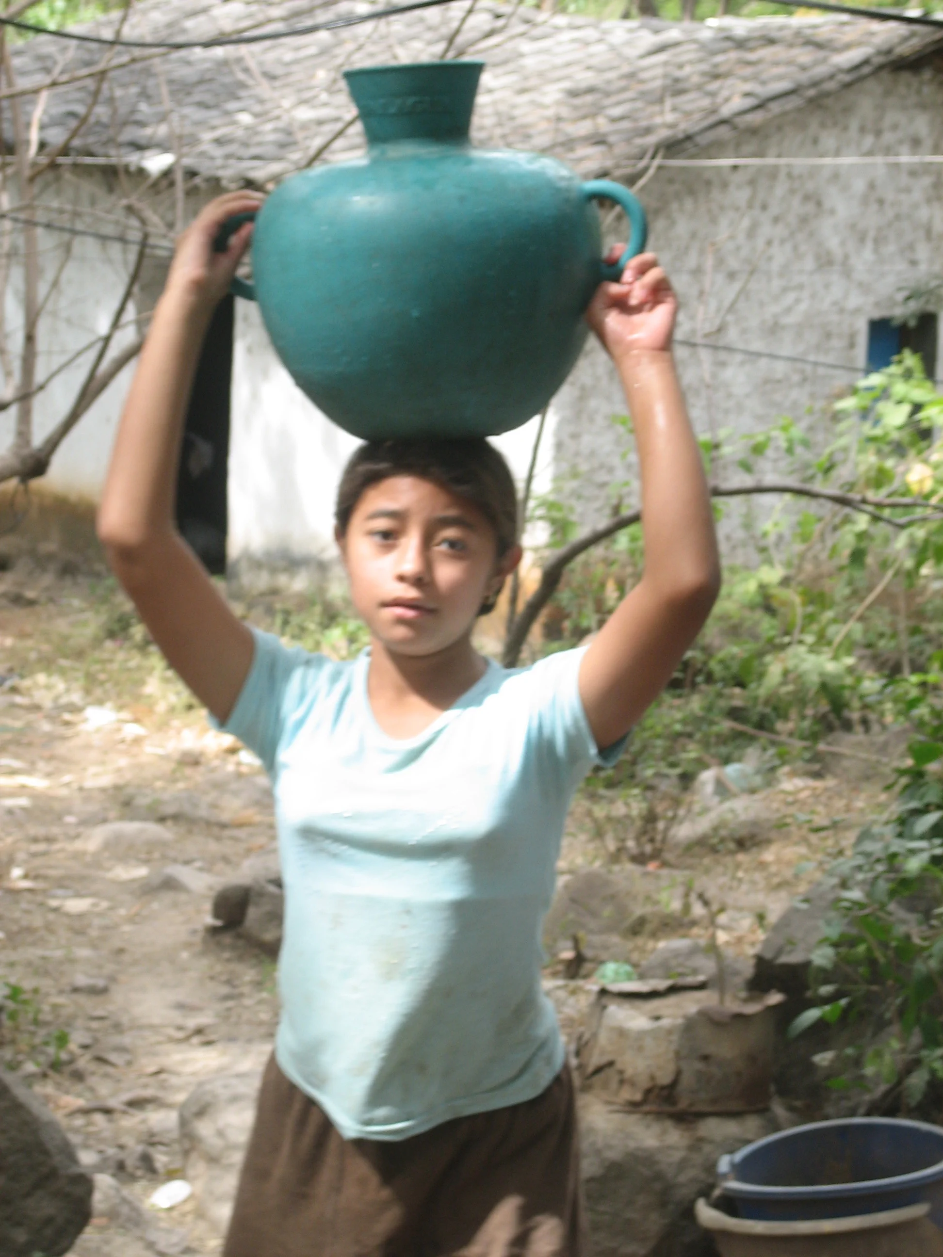 She makes this trip look easy. Carrying water 