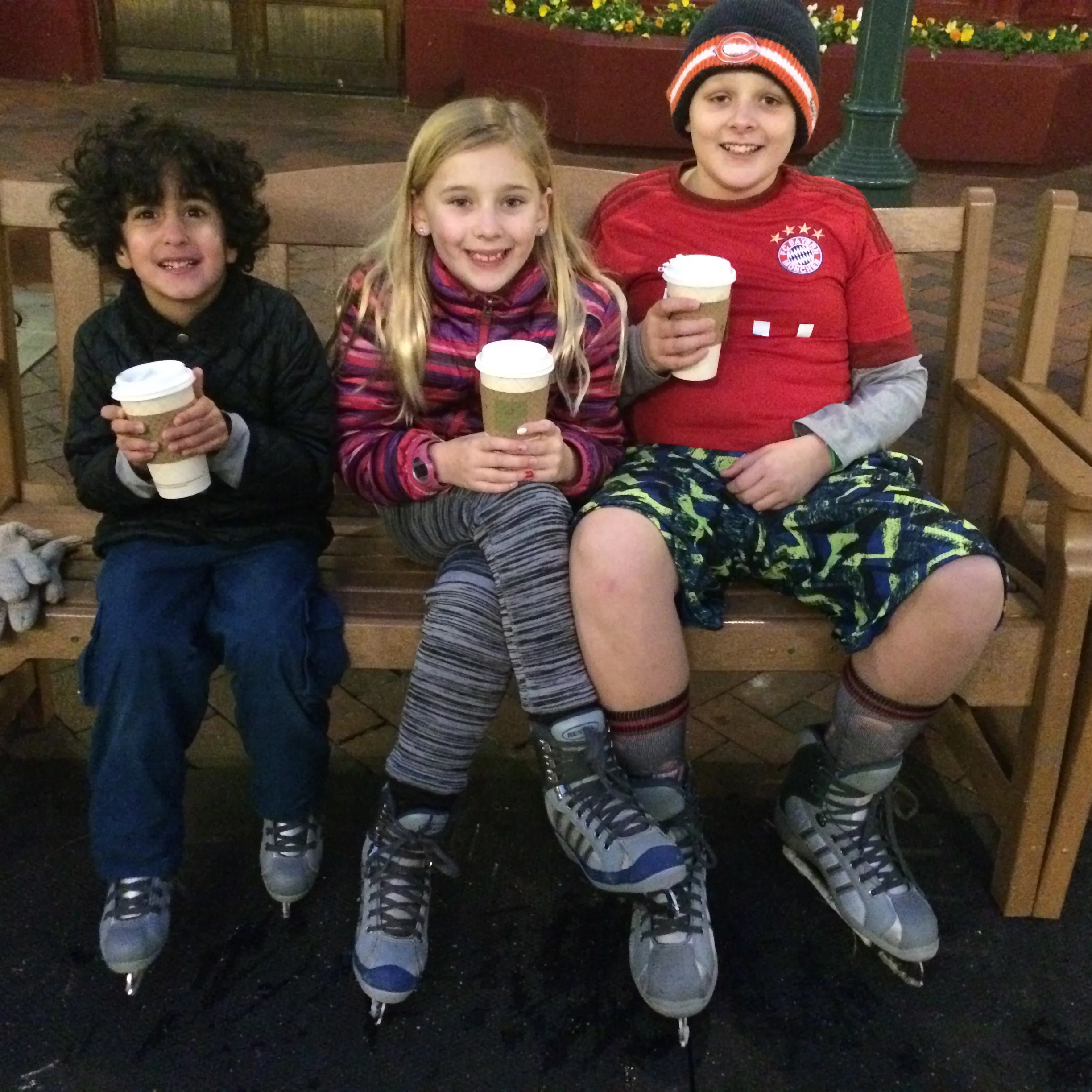 A hot chocolate celebration after Aubtin (left) could join the big kids free wheeling on the ice rink.