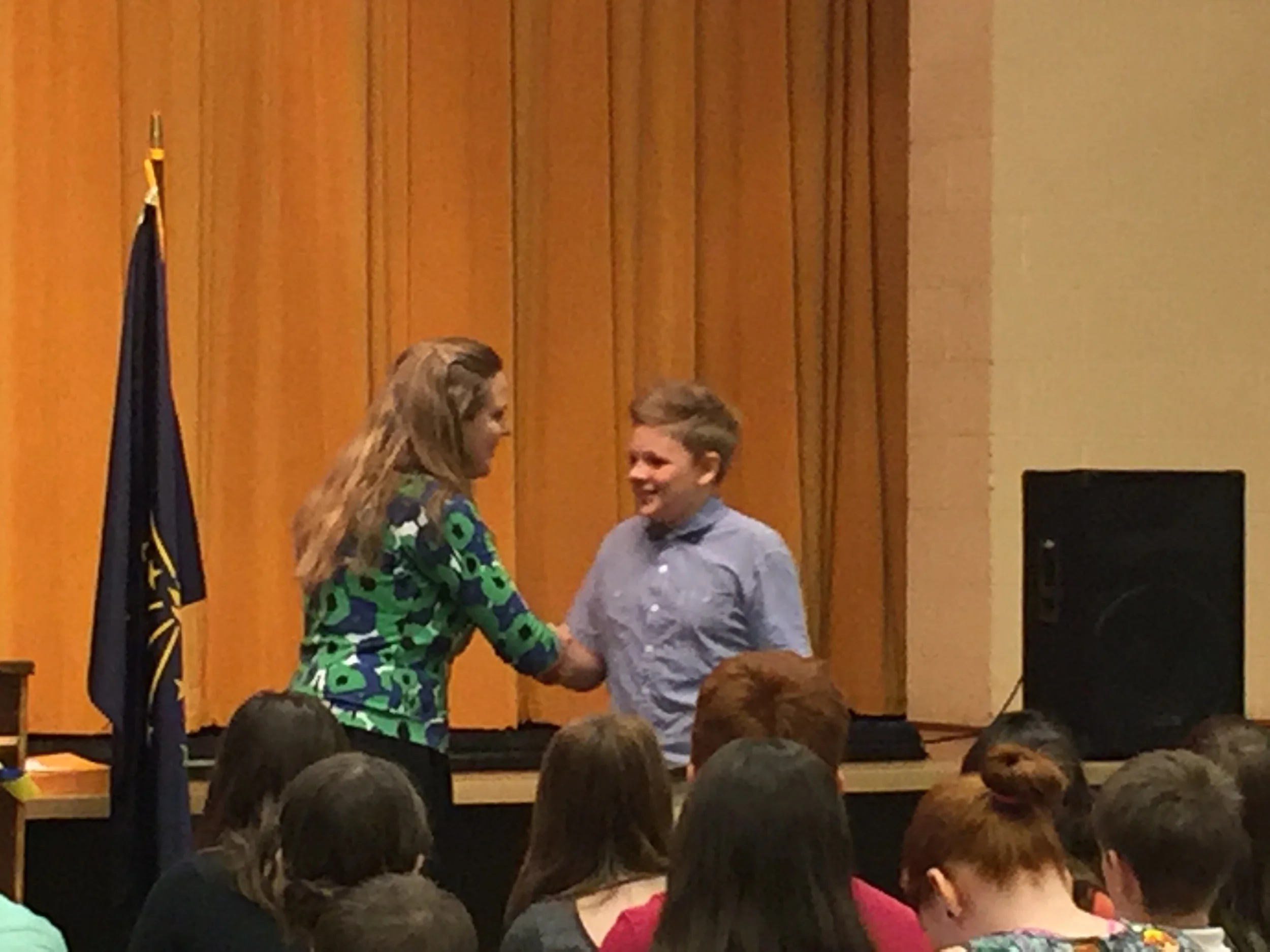 Sam receiving his diploma at 6th grade promotion last week