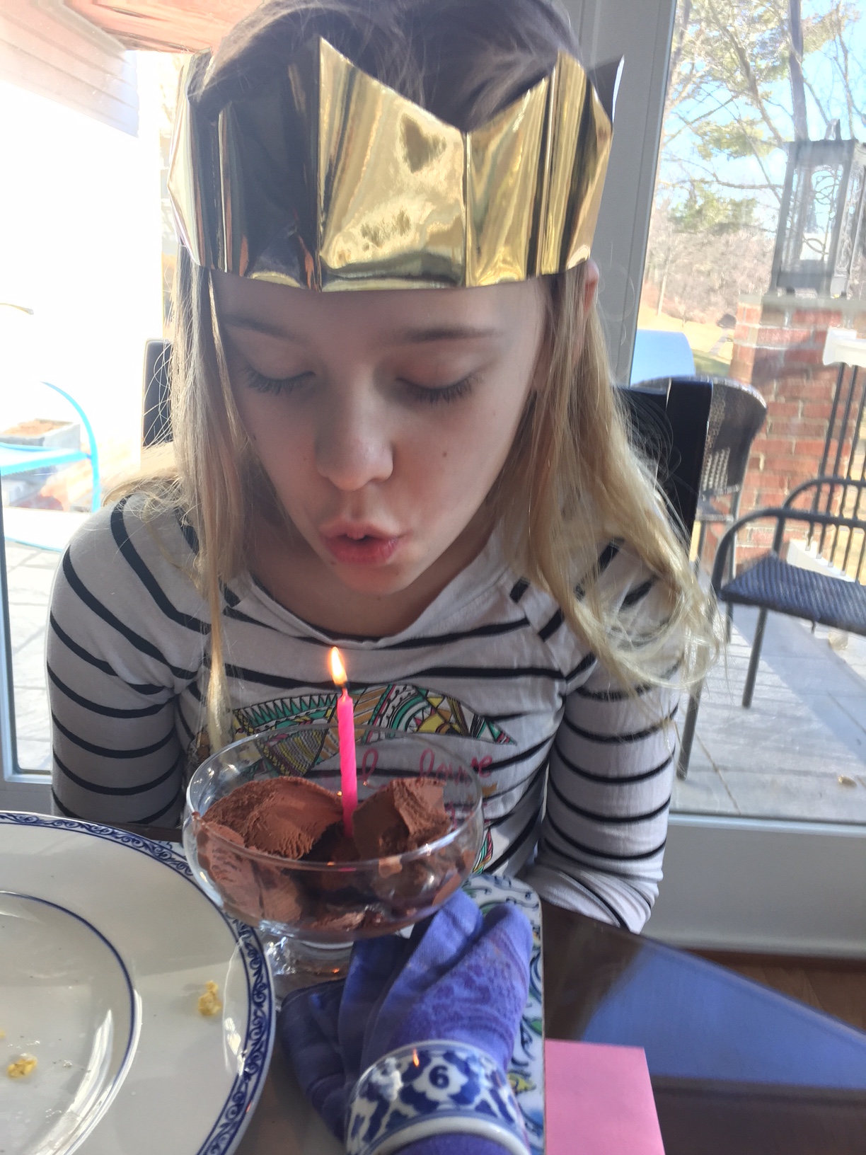 Blowing out her candle on her ice cream for breakfast 11th Birthday Celebration