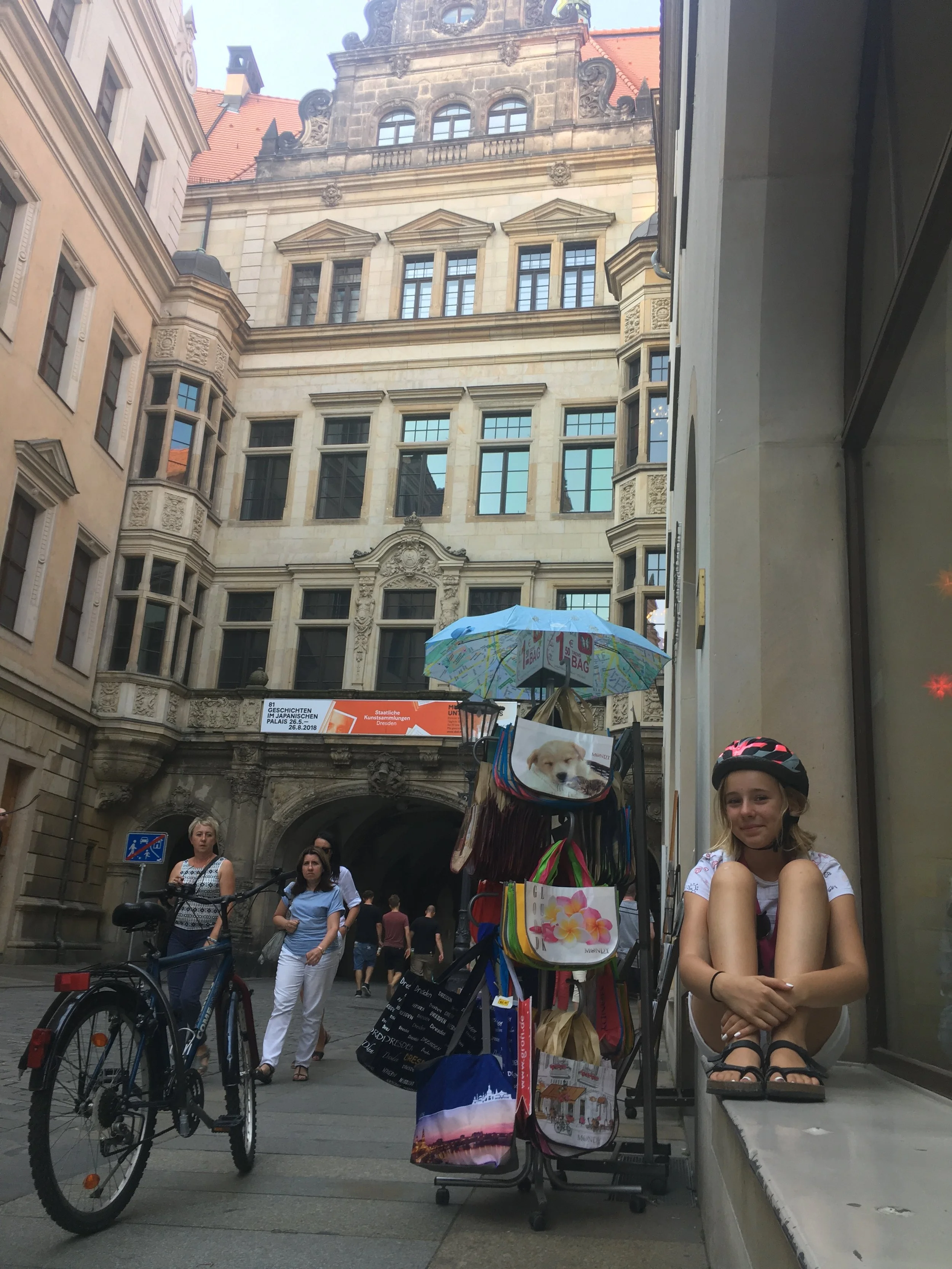 Watching the tourists go by outside the castle in her second home-- Dresden. This girl will be back, she's got big plans.