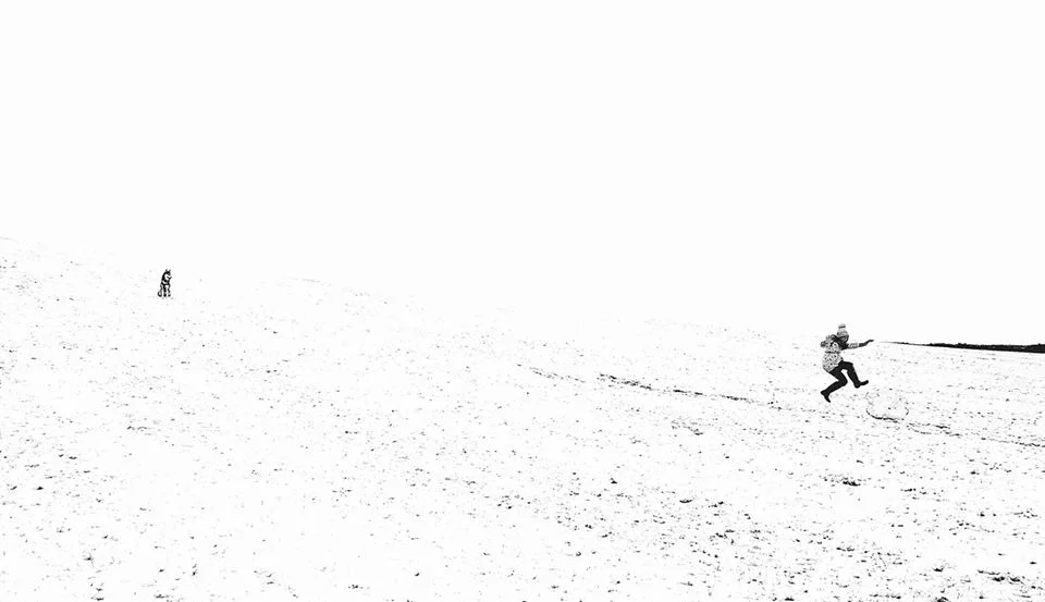 emma crushing snow boulder.jpg