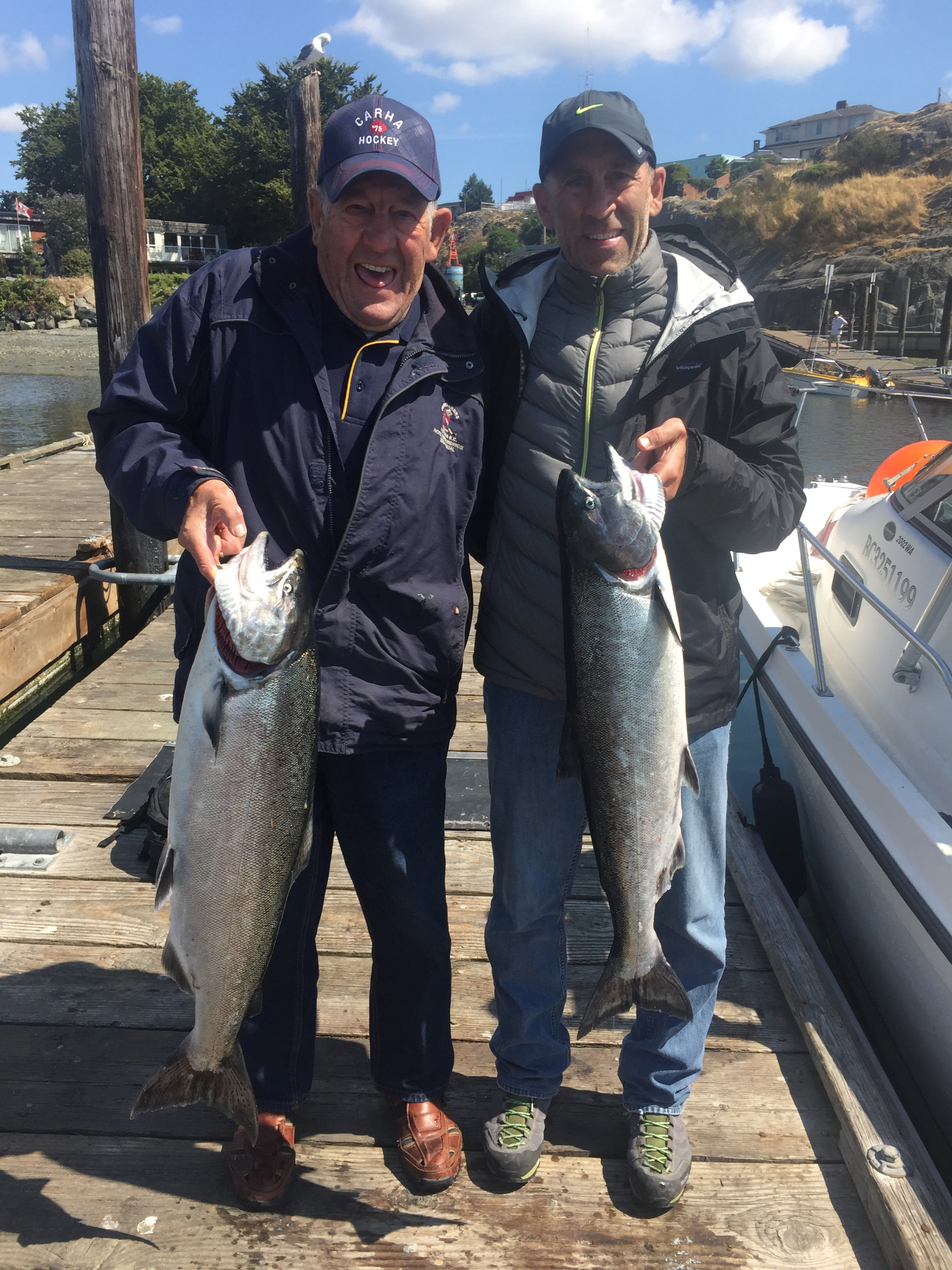 A couple of happy guests of Great Expectations Fishing Charters with a couple Chinook Salmon in Victoria, BC.