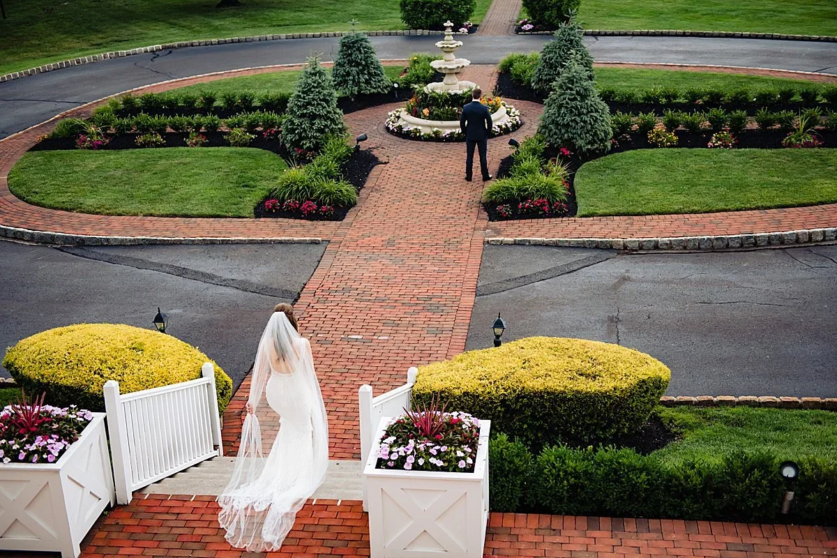 Bride walking down the brick garden path at Pen Ryn Estate