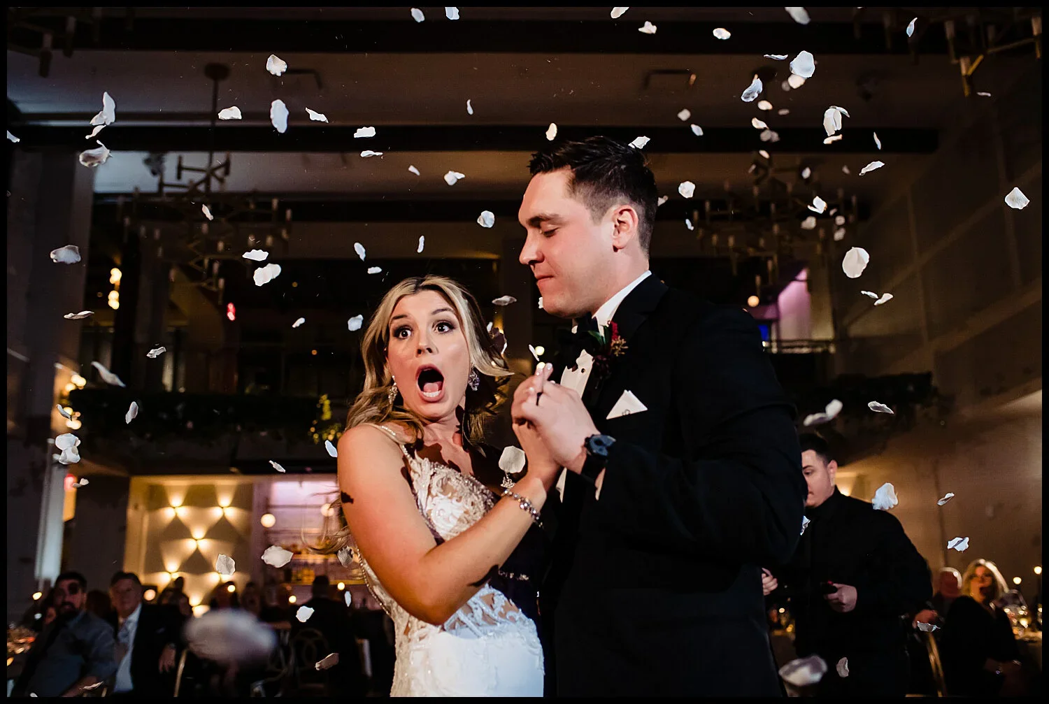 Bride's surprised reaction to the rose-petal cannon during the first dance at The Lucy