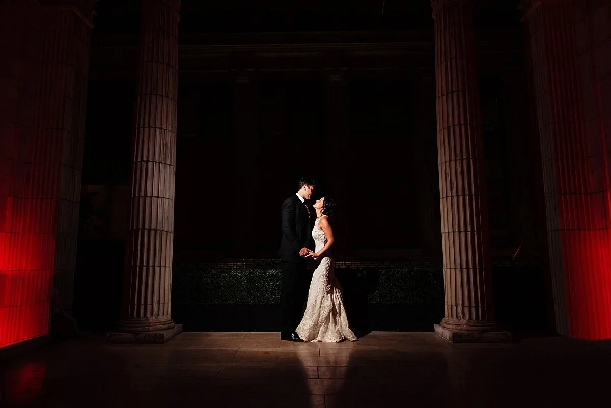 Krysta and Keven between the columns at Ballroom at the Ben