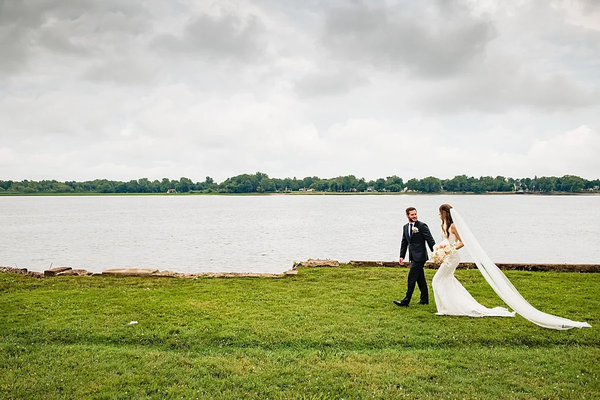 Maria and Brett on the lawn by the Delaware River at Pen Ryn Estate
