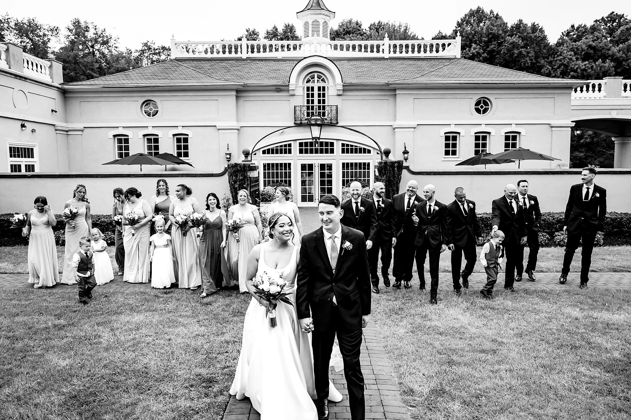 Wedding party on the lawn in front of the venue at Pen Ryn Estate