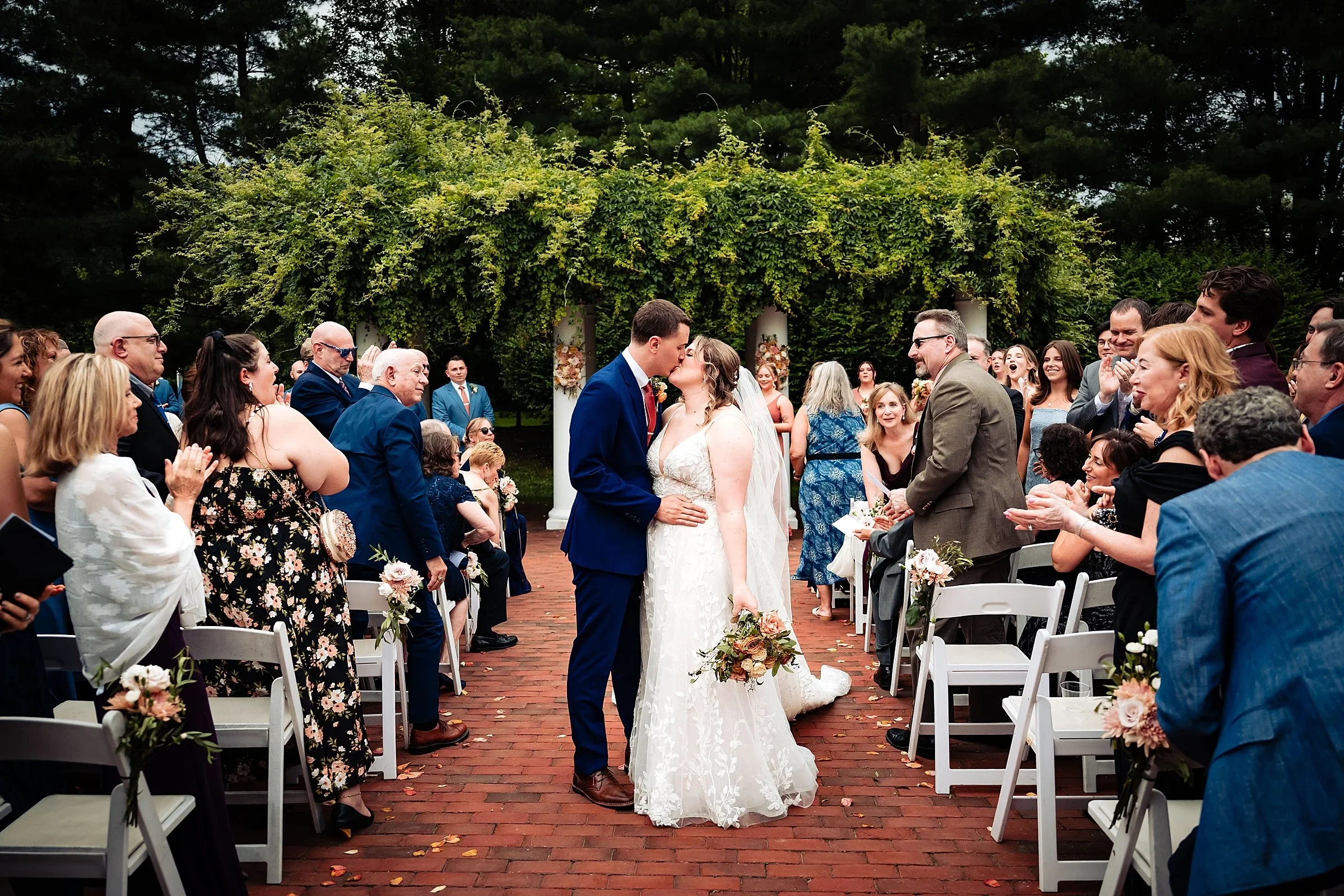 Couple walking back up the aisle after their outdoor ceremony at Pen Ryn Estate