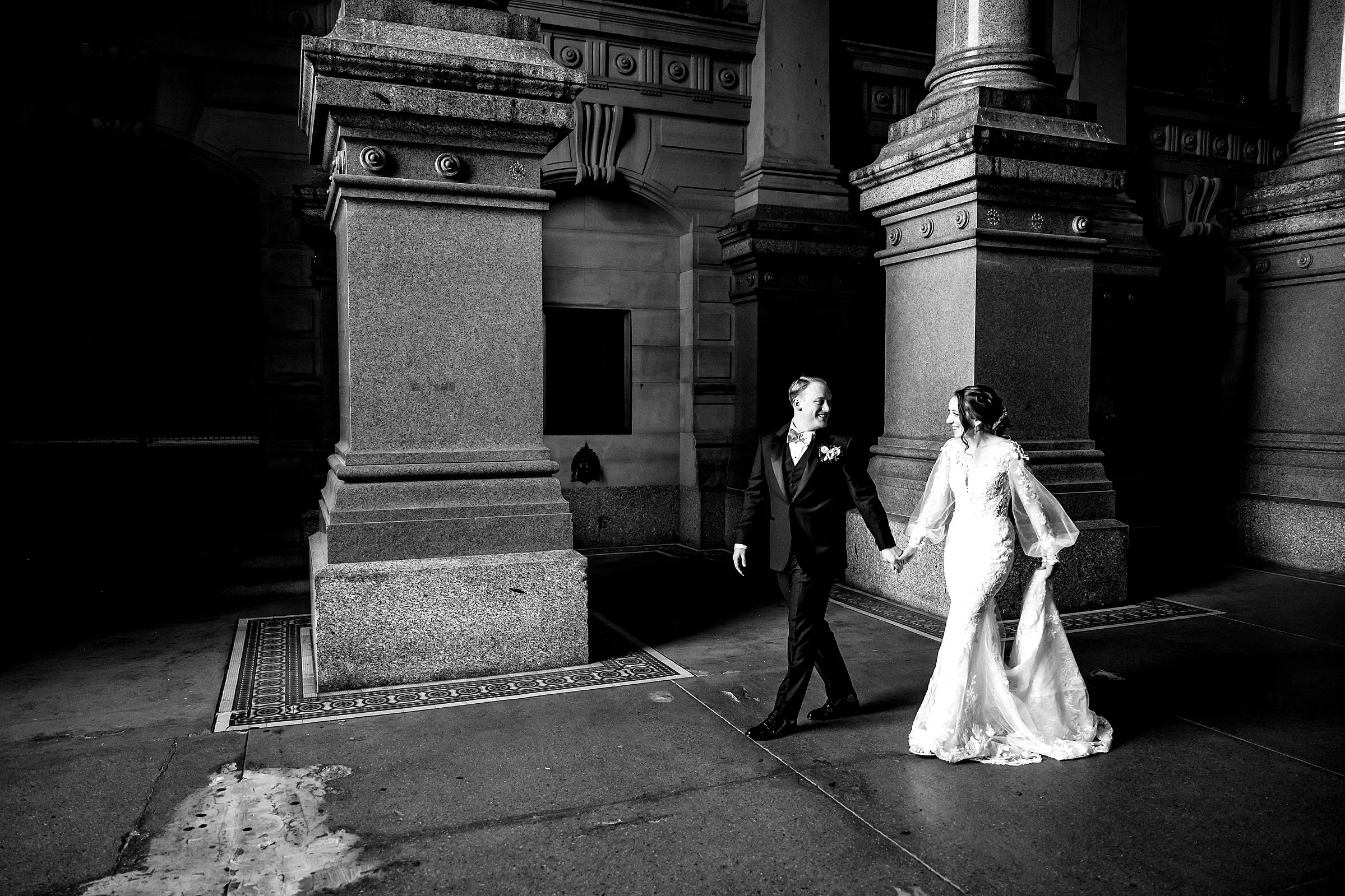 Couple walking near City Hall, a short walk from The Lucy
