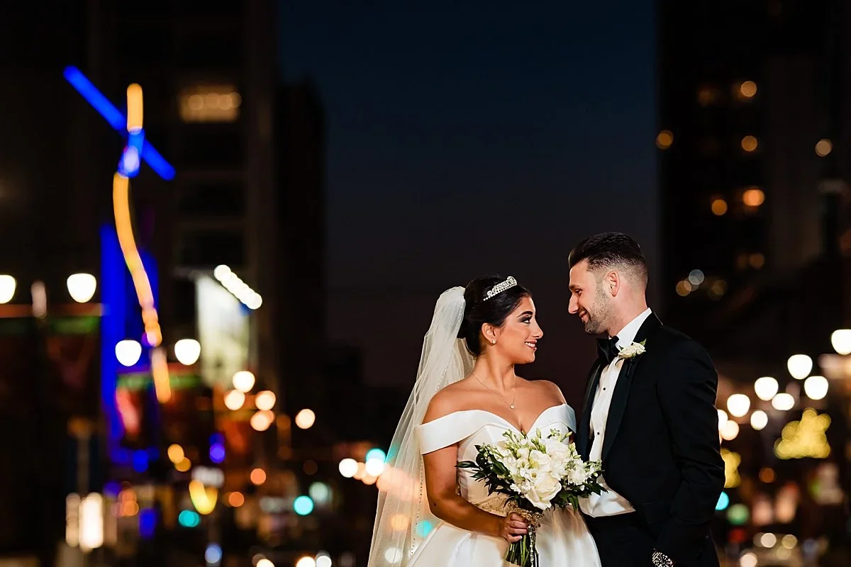 Alyssa and Anthony on Broad Street at night near The Lucy