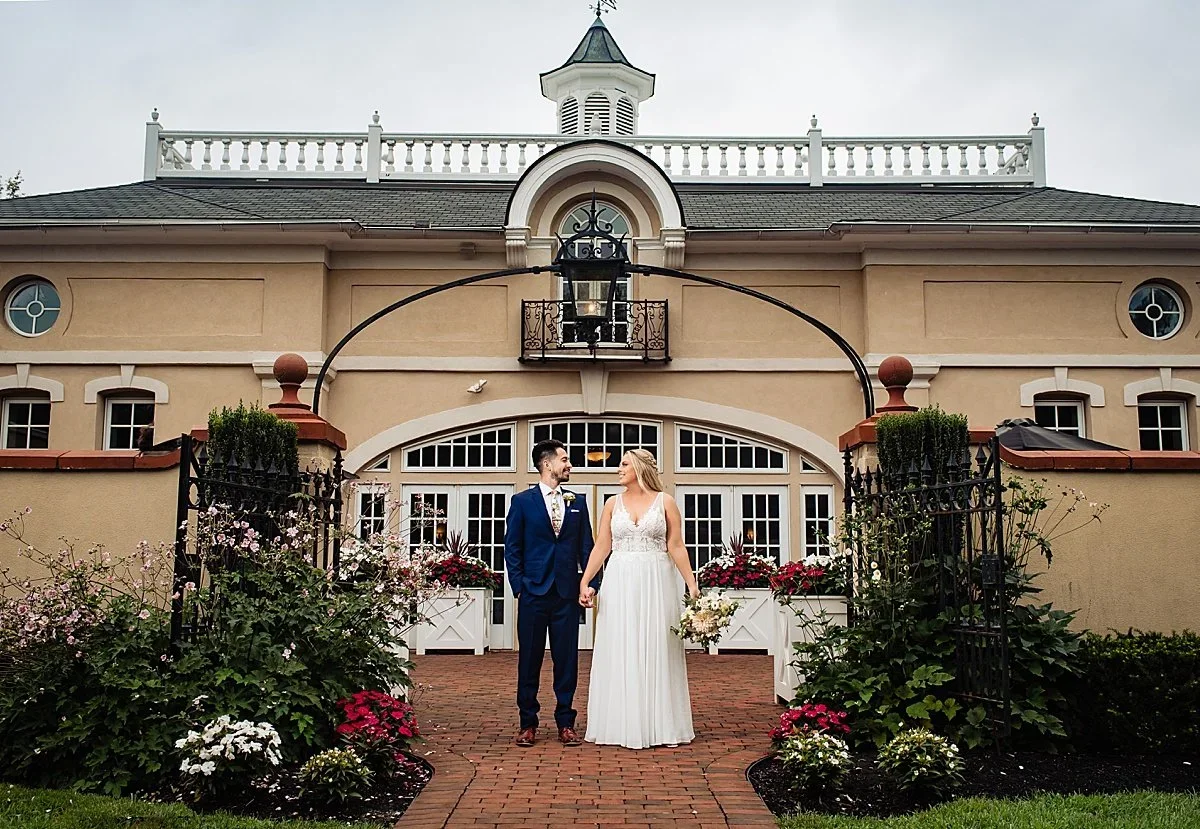 Meghan and Paul in front of Belle Voir Manor at Pen Ryn Estate