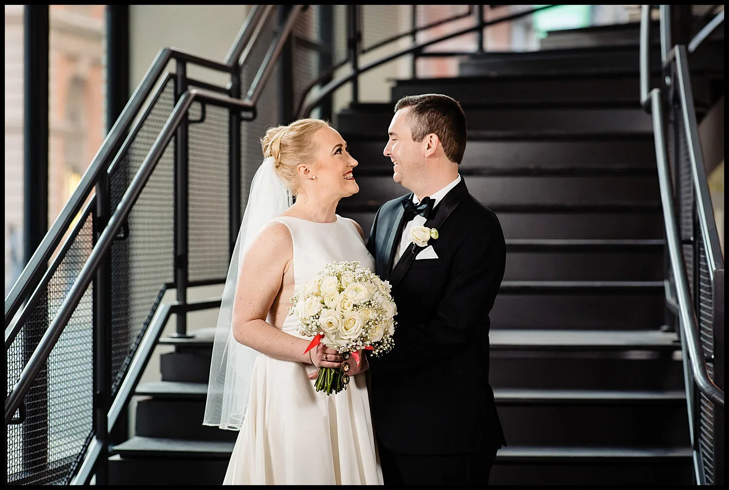 Patrice and Adam on the staircase at The Lucy