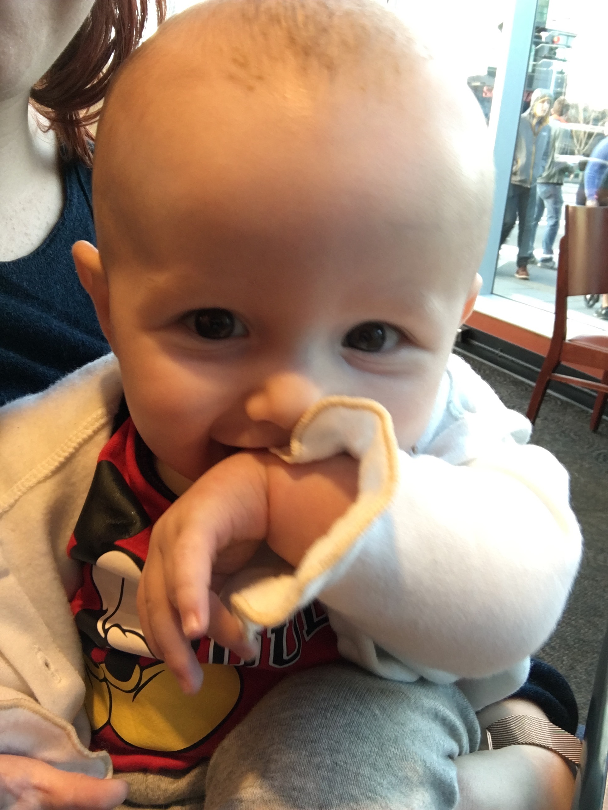 Little man is cuddled up in his jacket trying to stay warm!