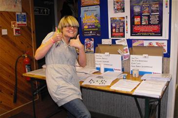 Lousie is managing the babes' auditions paperwork.