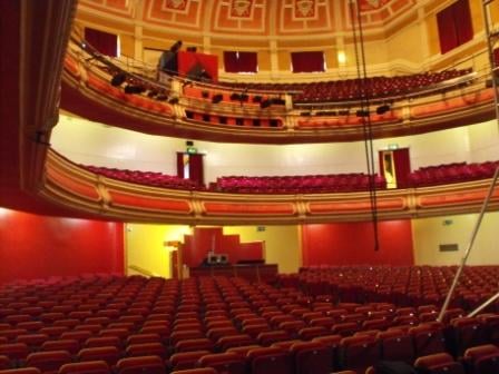 Left: The main staircase. Above: Inside the auditorium.