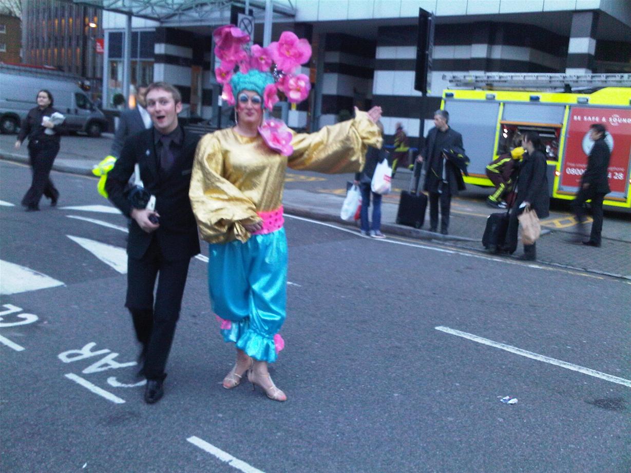 Theatre Manager J-J Almond escorts Panto Dame Graham Kent out of the building while the London Fire Service enter the building behind!