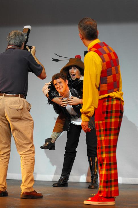 Neil sets up a shot with the photographer and James (Eugene) and Ste (Pimple)