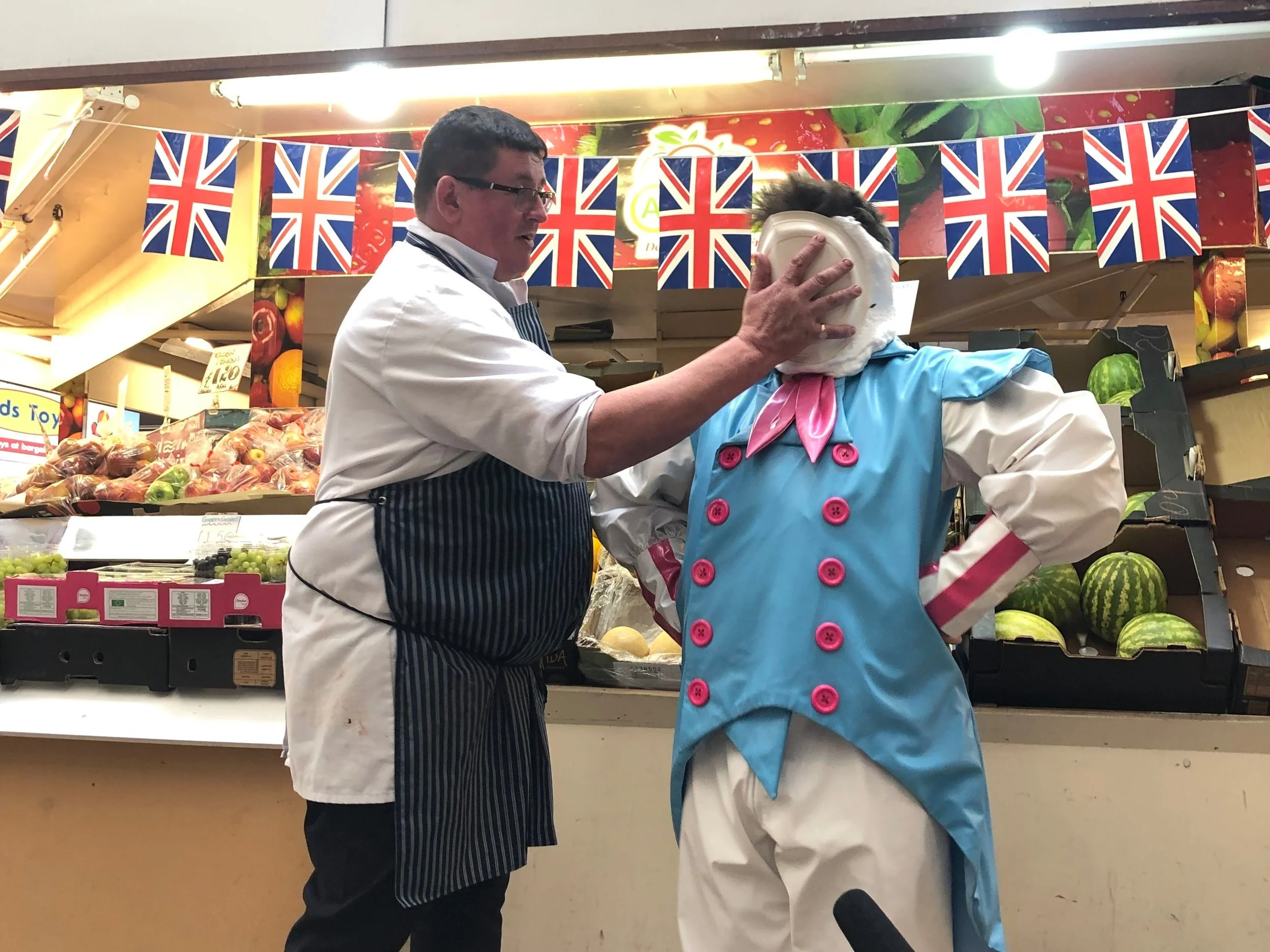 …. and another pie in the face outslde Woresman’s Greengrocers, courtesy of Mick from Grosvenors butchers.