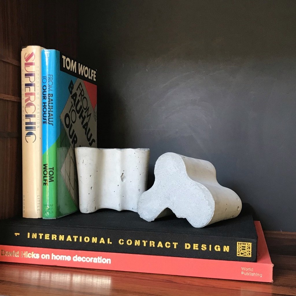 Concrete book ends/door stops by Alvar Aalto.