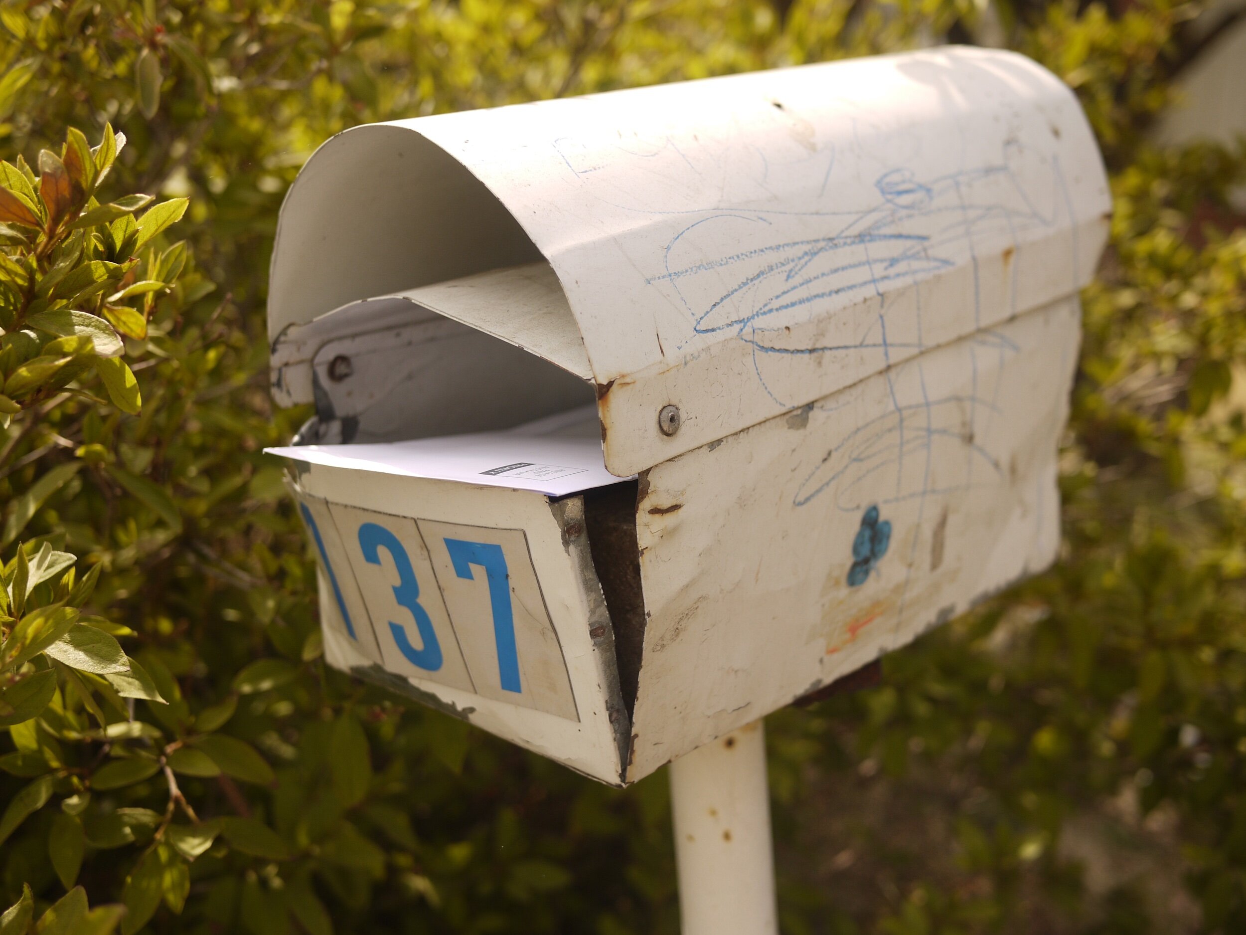 Matching blue crayon to blue address numbers? I don’t think it’s possible to scribble on a mailbox any more perfect than this.