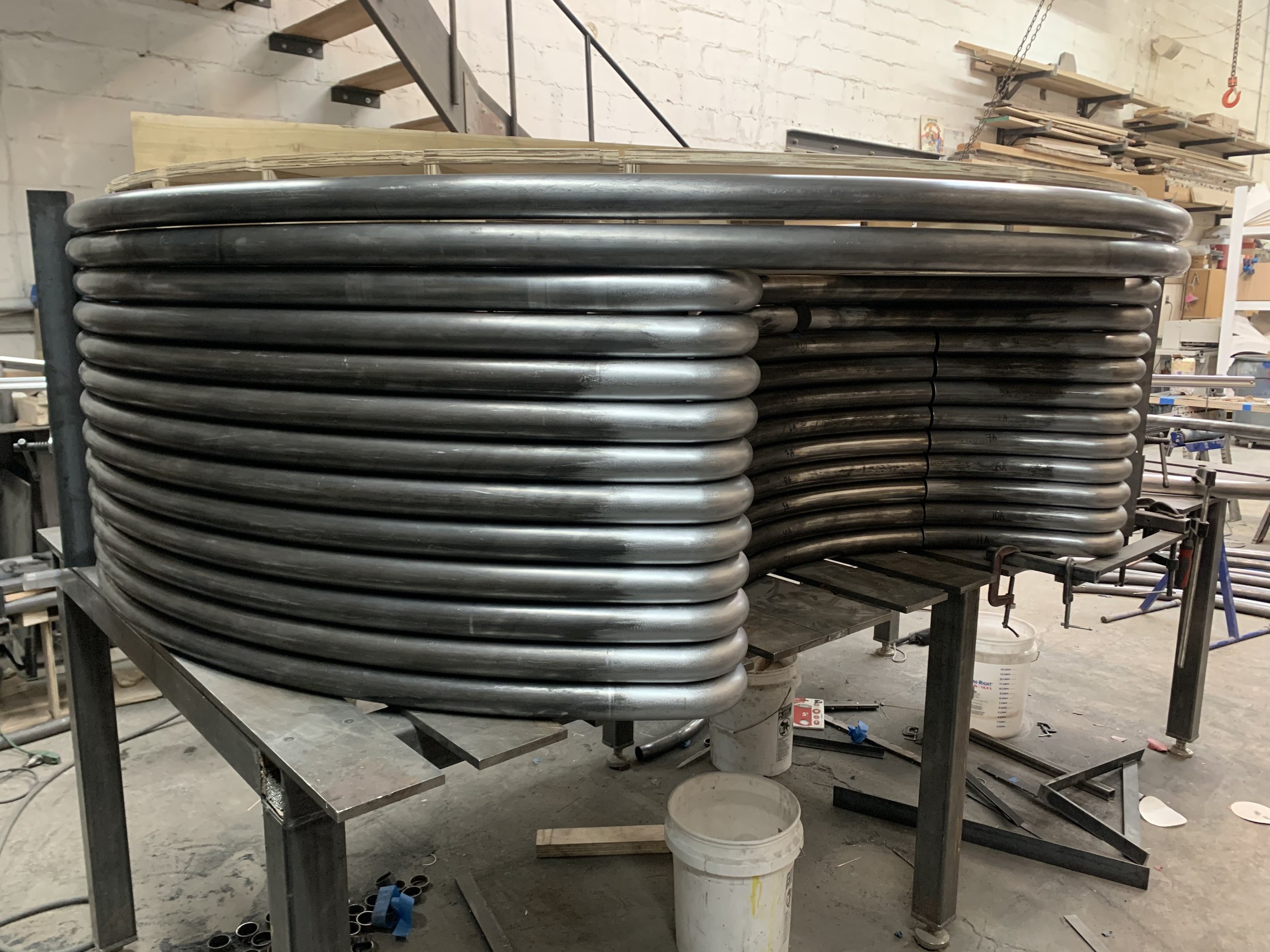 Current project for a new Glossier’ Miami location featuring center piece circular wet bar and 1/3 circle bench.