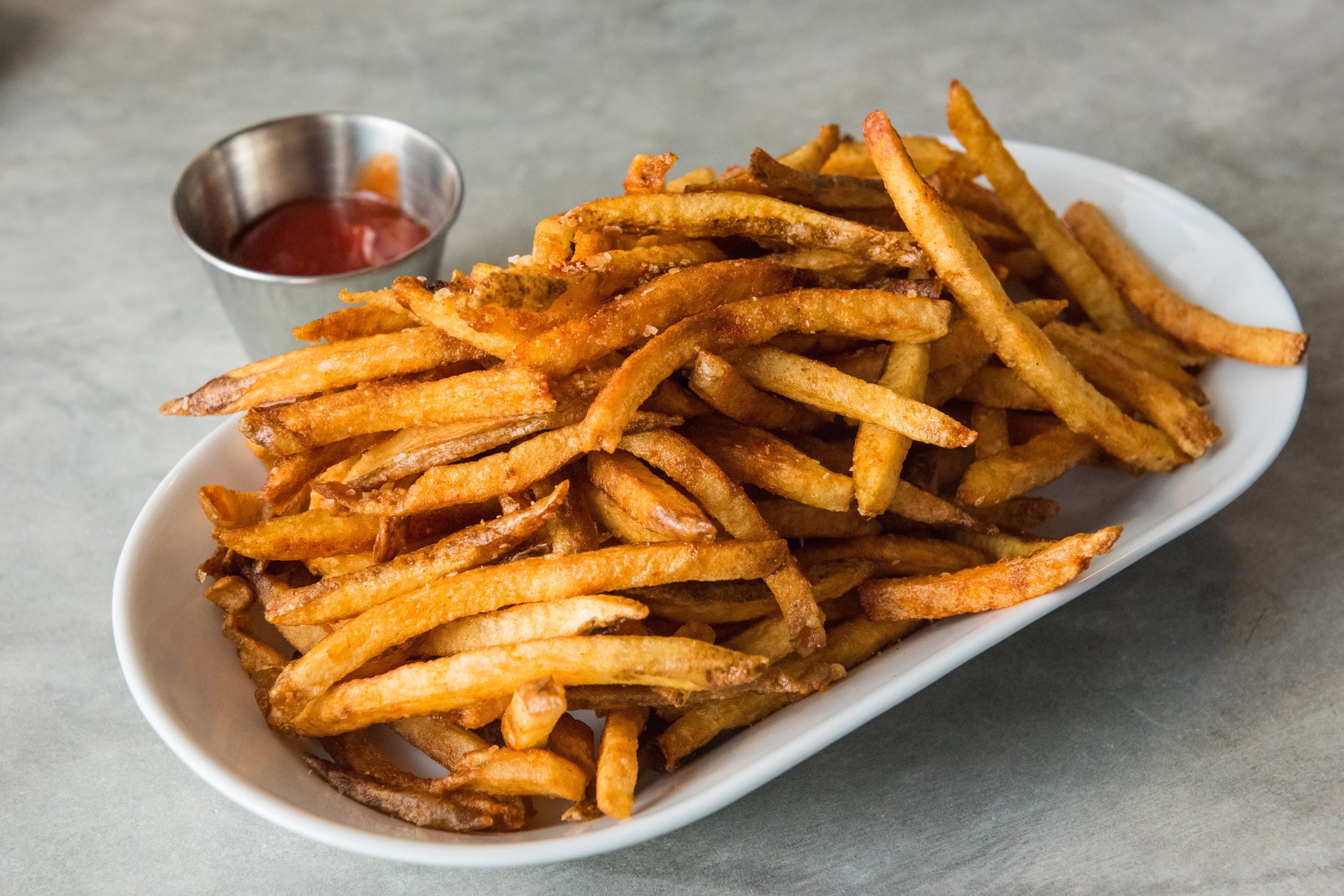order a side of seasoned french fries to share at Thirsty Mermaid
