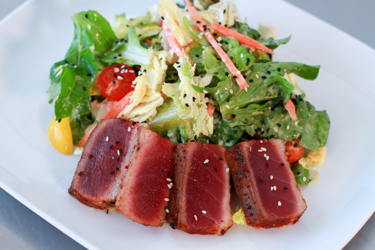 Seared Yellowfin Tuna Salad served on a bed of baby greens at Thirsty Mermaid