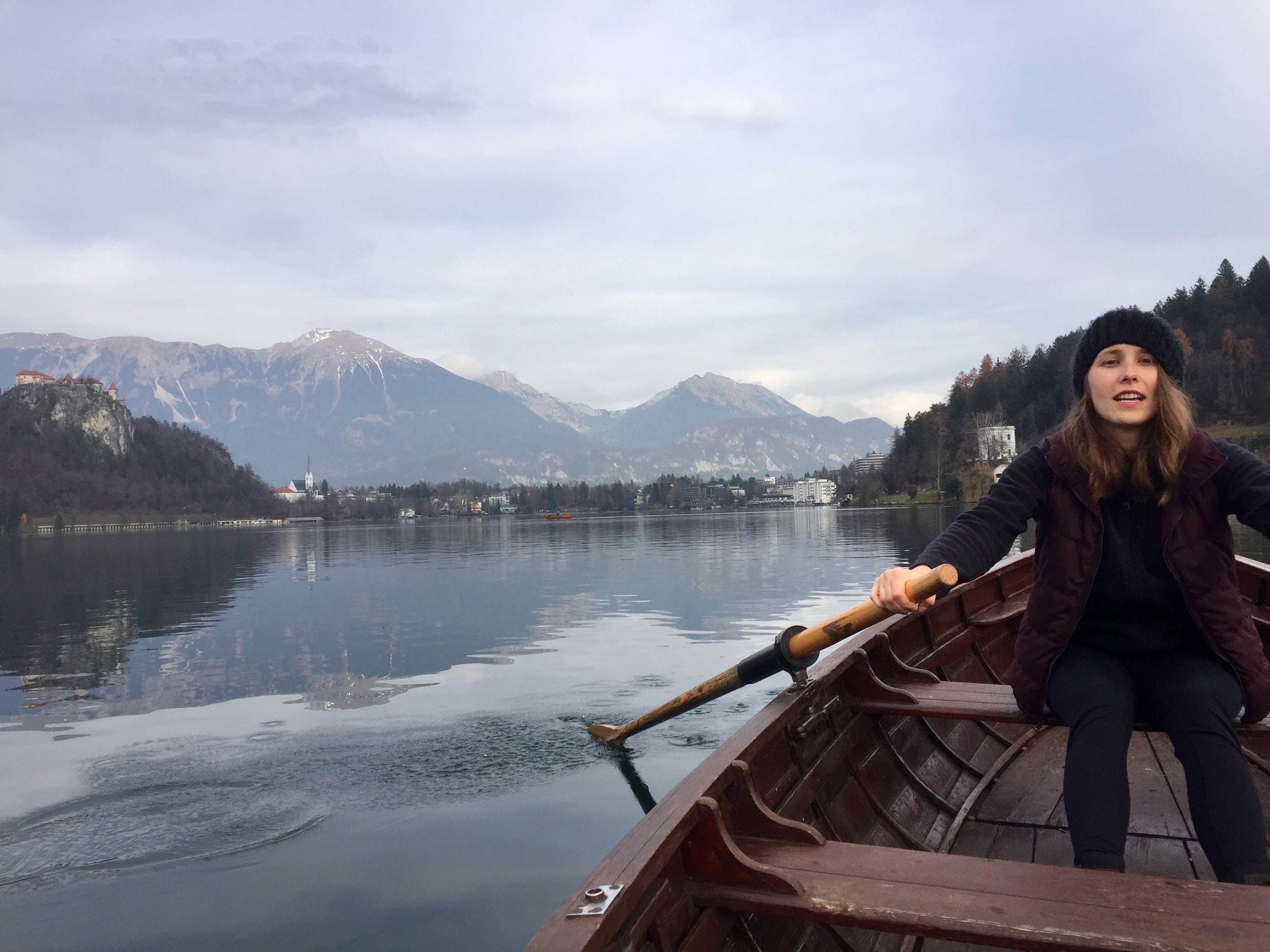 Attempting to row on Lake Bled; views of the Alps in the distance