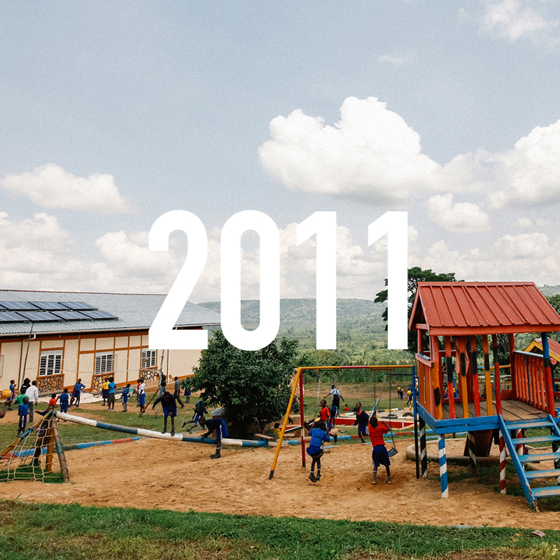 Katuuso Primary and Vocational School (KPVS) opens in Uganda with 2 classrooms, an outdoor shade shelter and 10 toilets, 80 students in Pre-Primary and Primary 1 and 4 teachers.