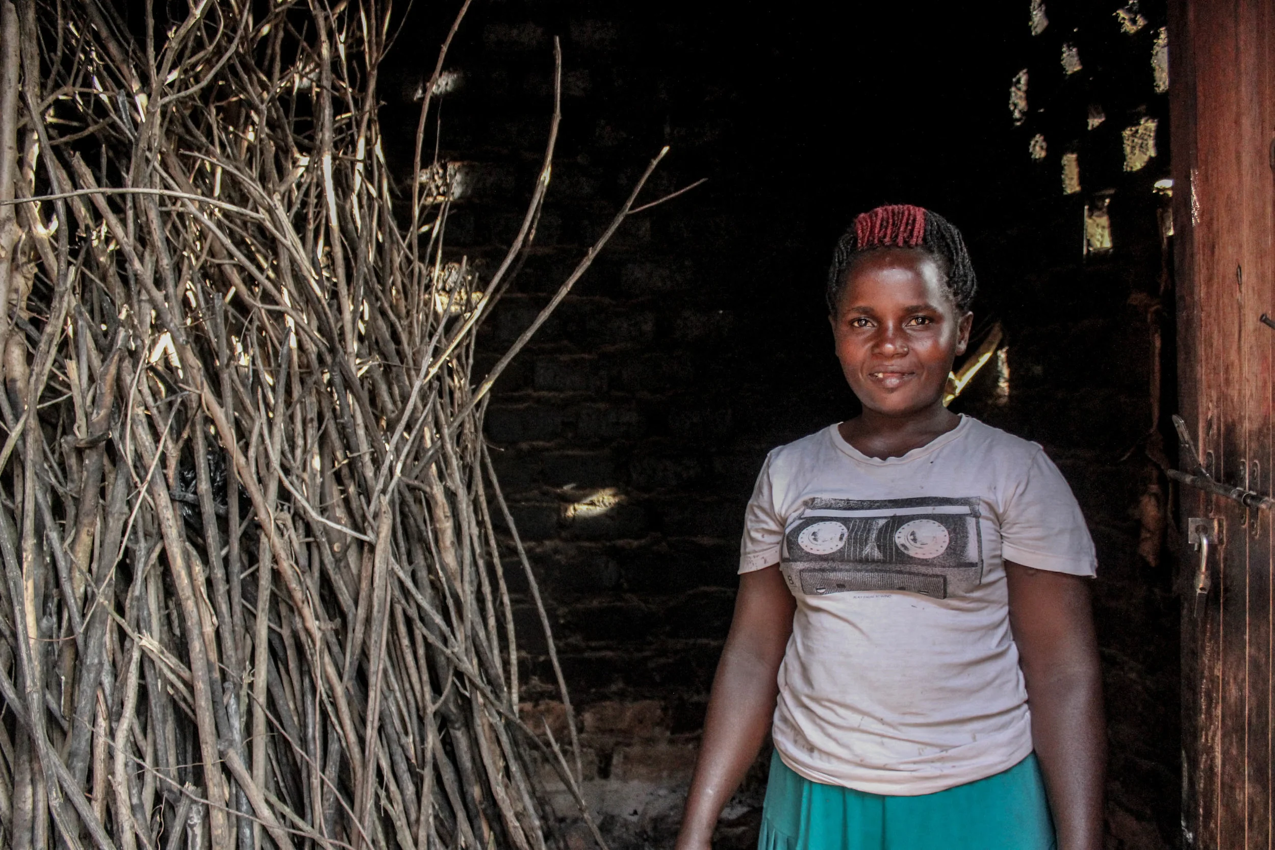 Goretti's aunt prepares all the meals for her big family from this small outdoor hut. On the day we visited she was cooking beans and cassava for dinner, a staple meal for Ugandans.