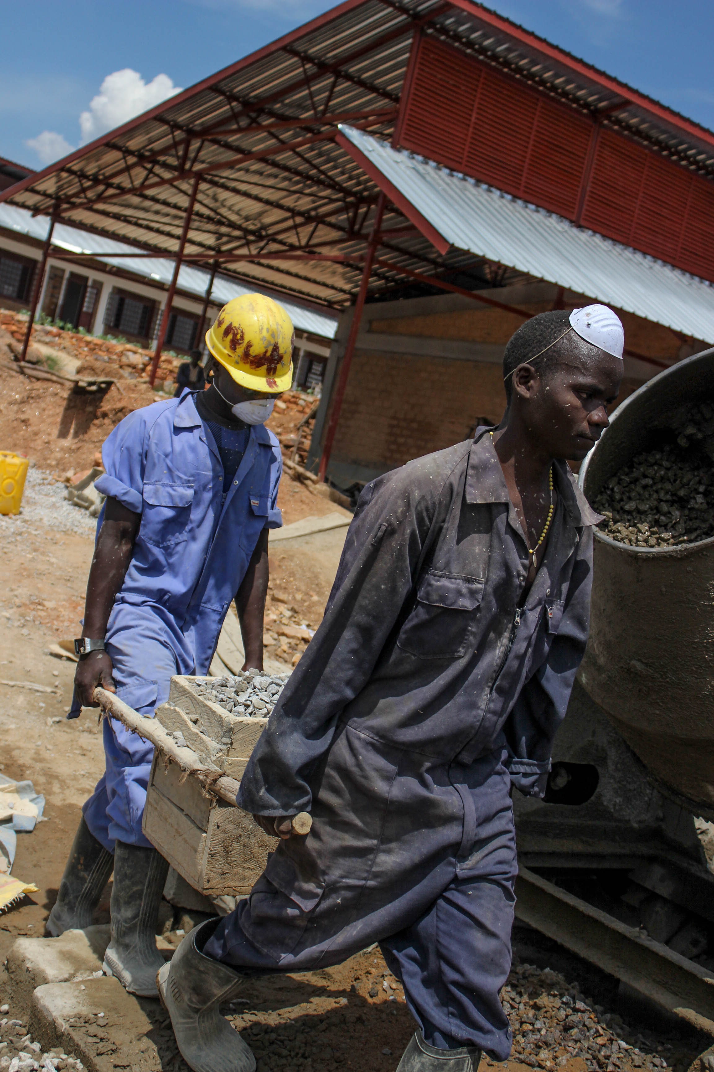 Cement for the floors of block two being prepared on site.