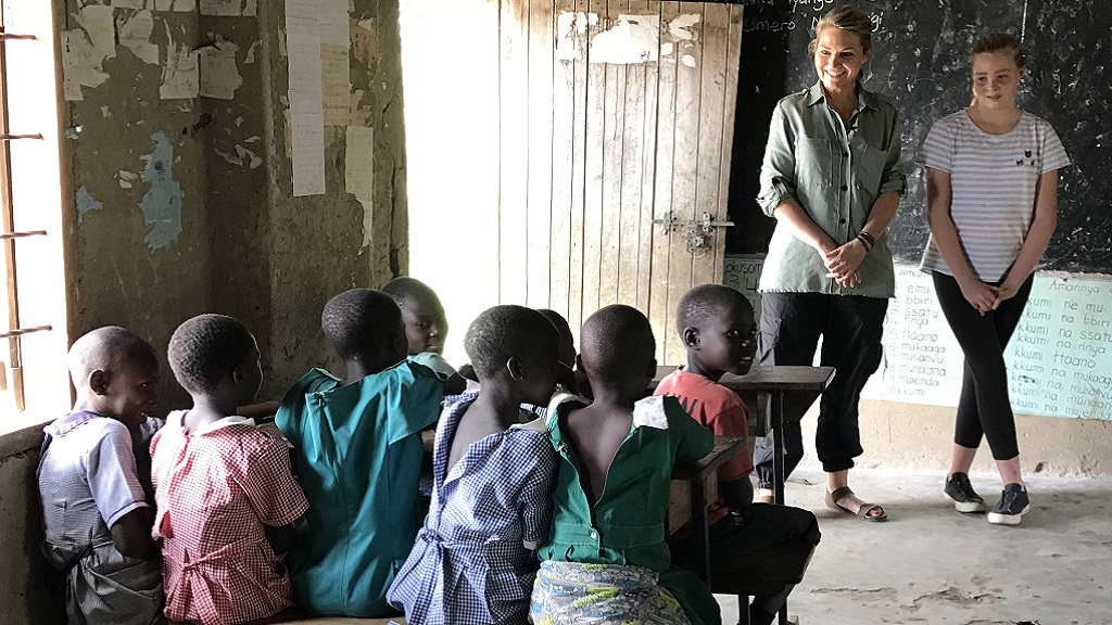 Bronte stays close to her Mum's side at the first government school they visit in Uganda. 