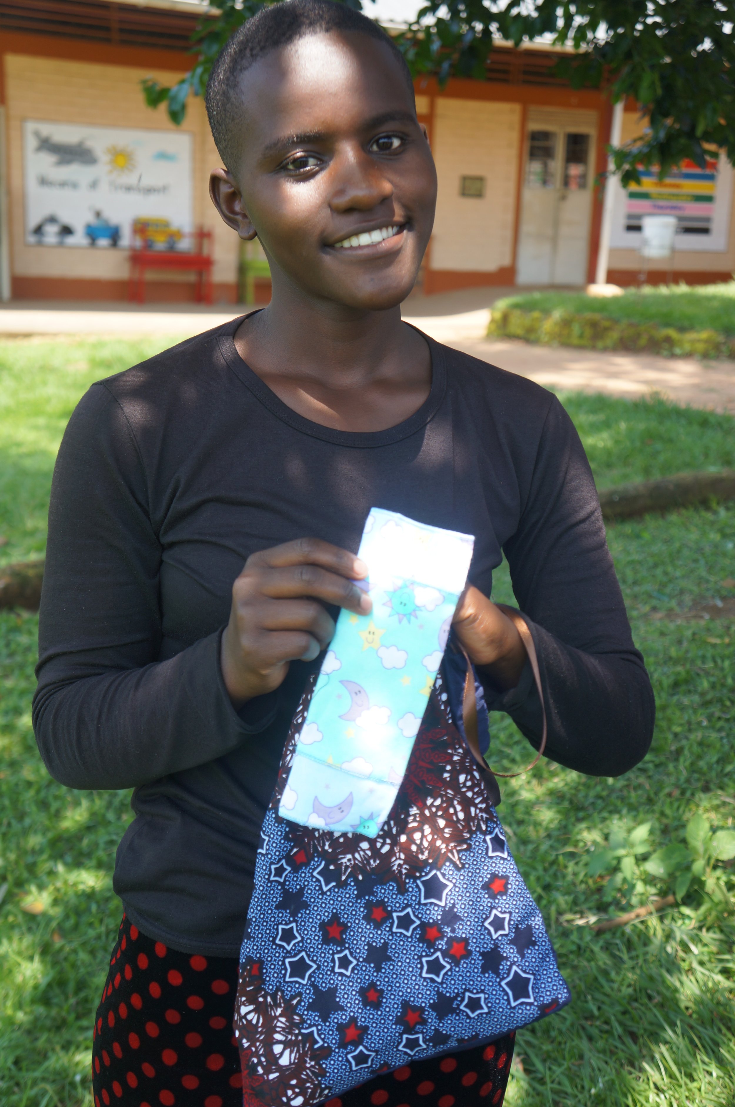 Lyn distributing sanitary pads to our high school students inkatuuso (6).JPG