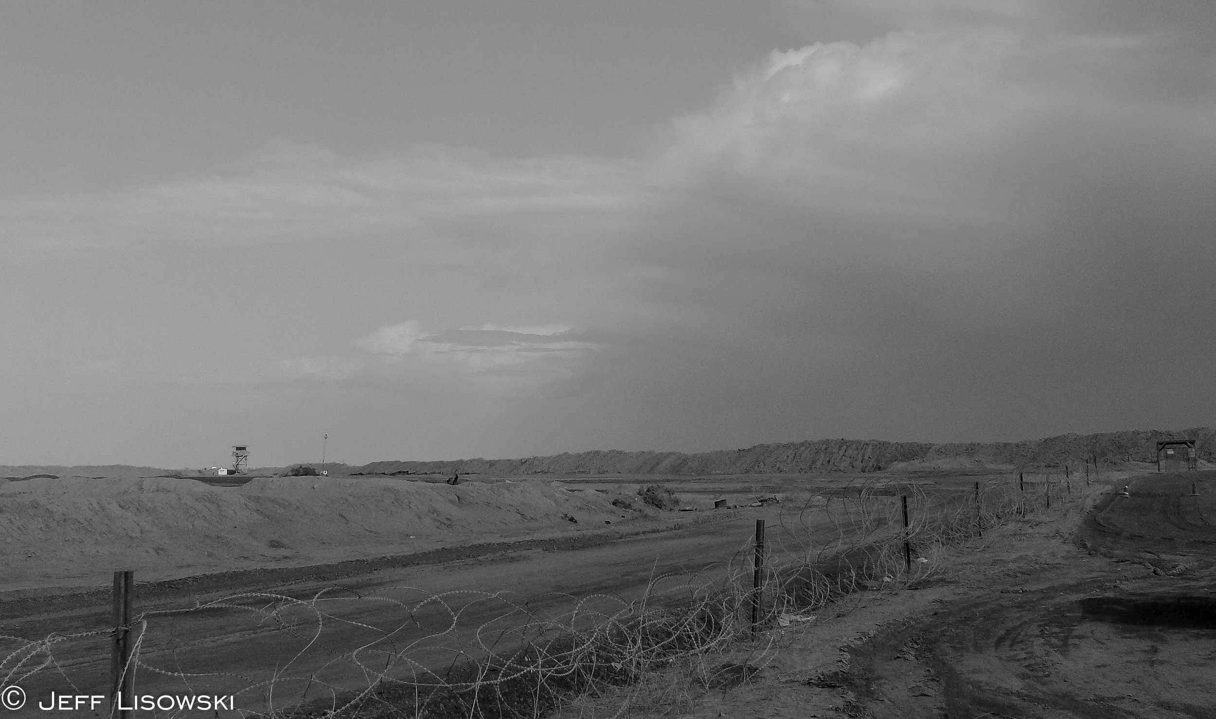 A thunder- and dust- storm rolls across Camp Cedar and Nasiriyah in November of 2009. 