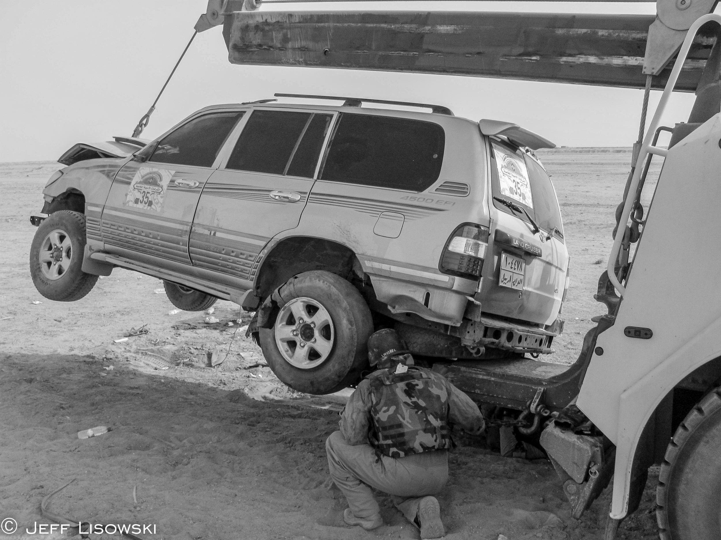 When the HET trailer was full and you got called to pick up more equipment- you improvised. Here a British security company's armored SUV is loaded onto the underreach of our EMPL wrecker. Hey, it worked. 