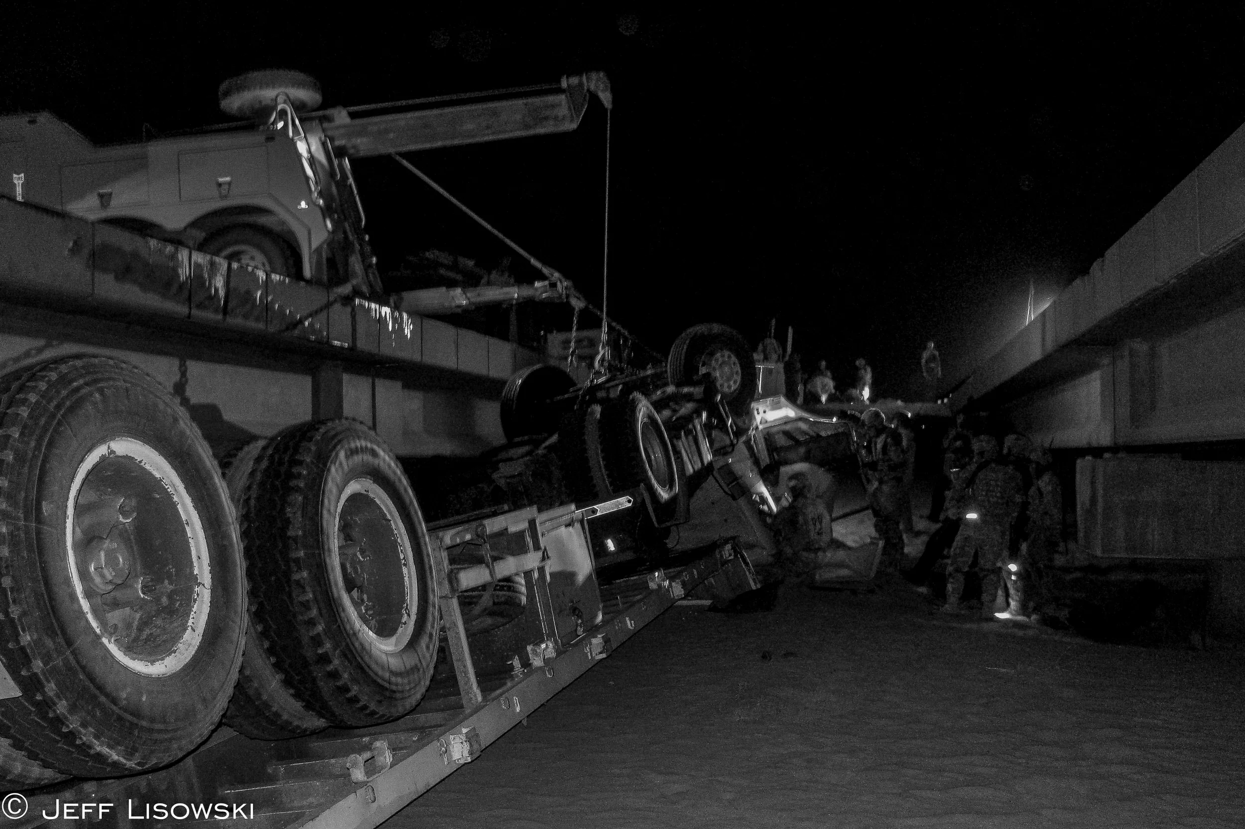 Sometimes we were tasked to help out the Iraqi's with their own mishaps. Here an Iraqi flatbed tractor trailer overturned on a bridge going south on Tampa. Three Iraqis were trapped under and inside the cab of the truck. There was no ambulance, no AAA coming. It was just us. 