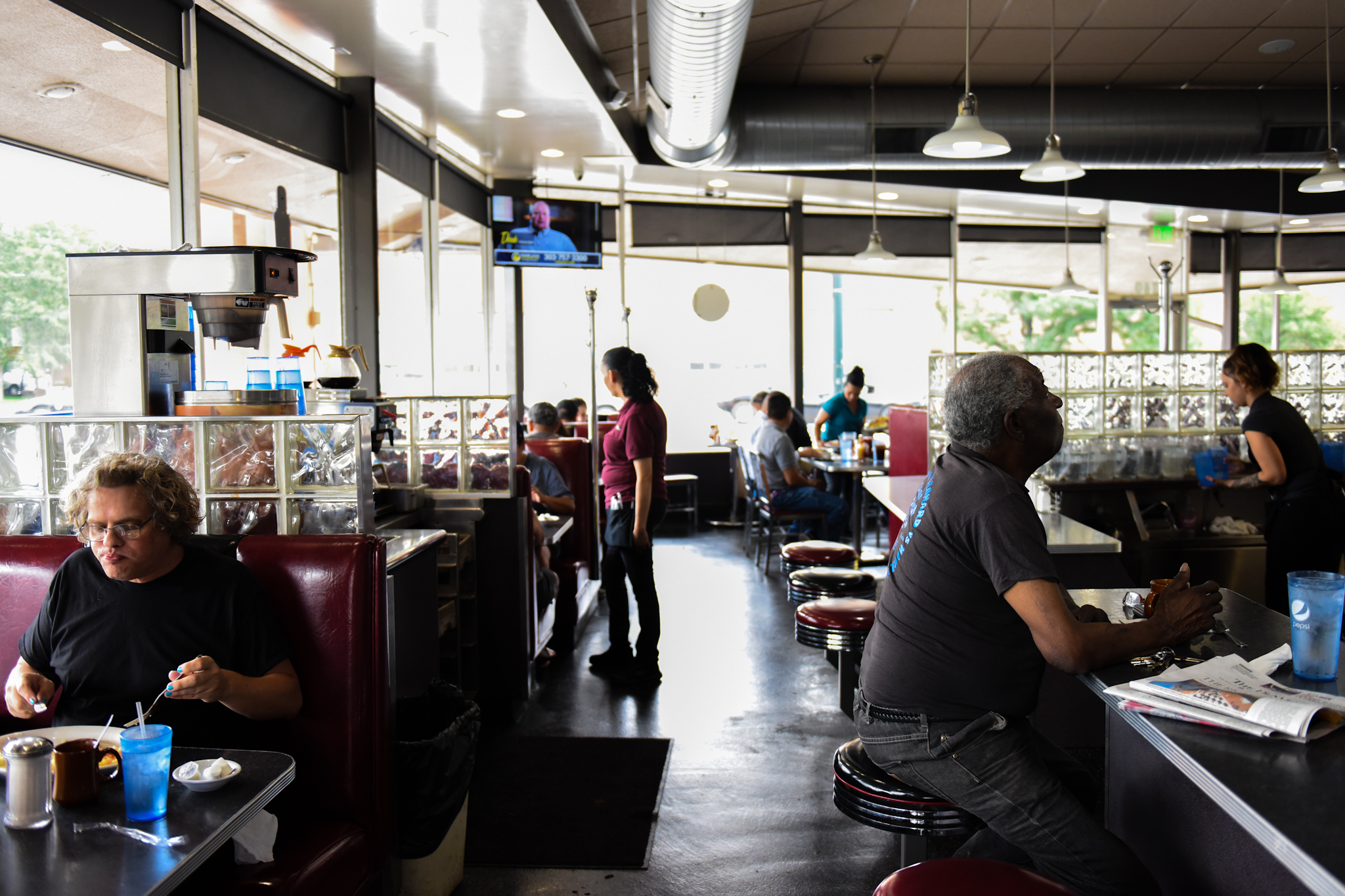 Servers bustle around the diner during lunch.