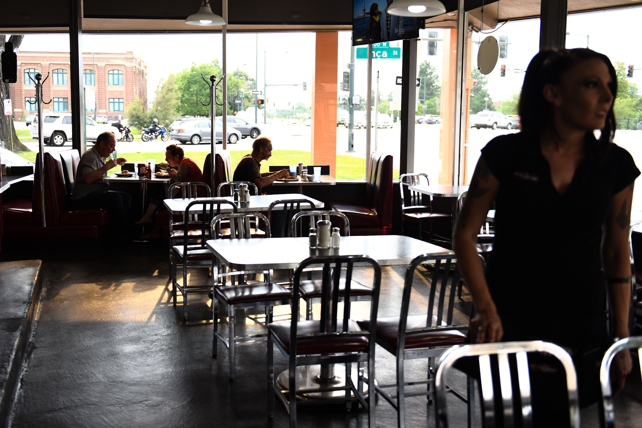 Lauralei Holliday serves a few patrons in the diner around dinner time.