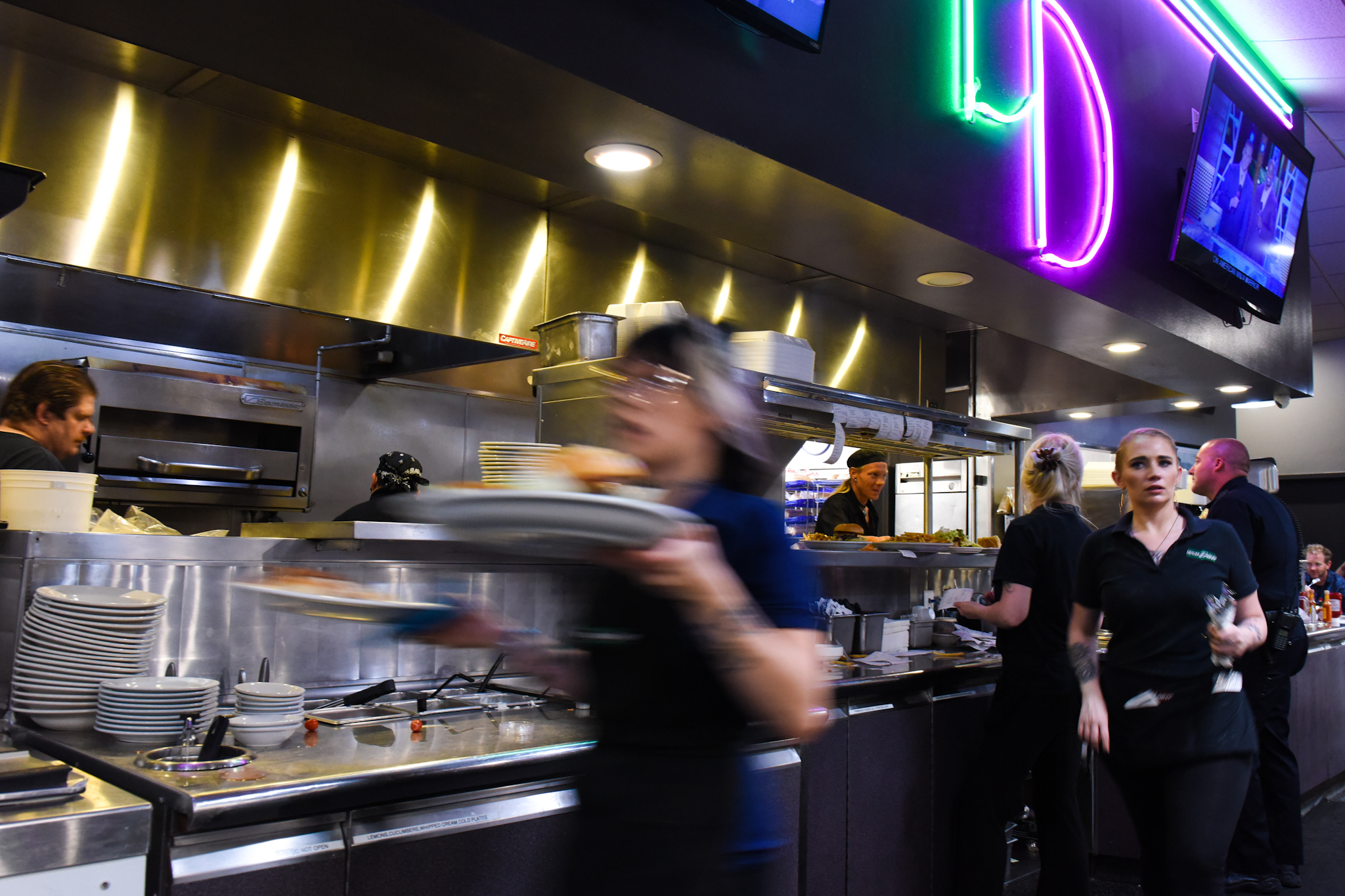 1 a.m.: Server Heather Blanchet rushes plates to a table.