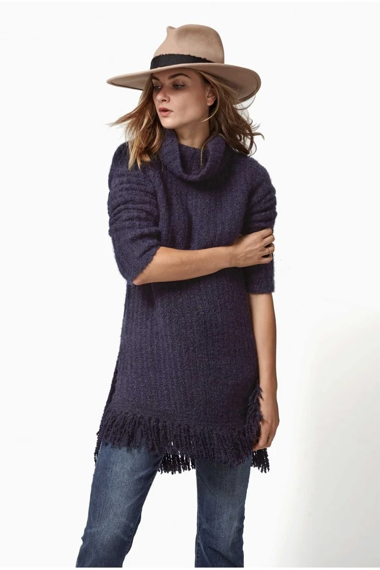 The Ajax sweater is our most lux piece of the season – Cashmere and silk boucle Italian yarn knitted into an asymmetrical turtleneck a fringe hem. It is the softest thing I’ve ever worn!